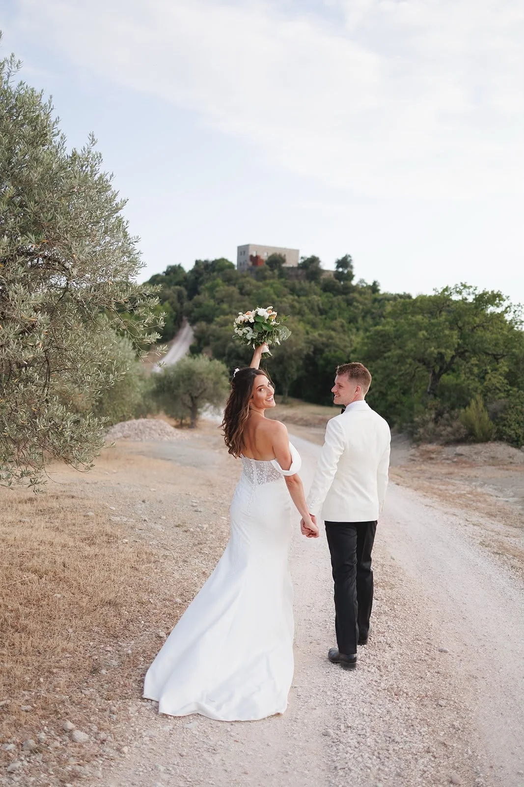 Oliver & Nikkita Vass - Oliver wears white tuxedo jacket and black dinner trousers, with dress shirt also made by Roberto Revilla London