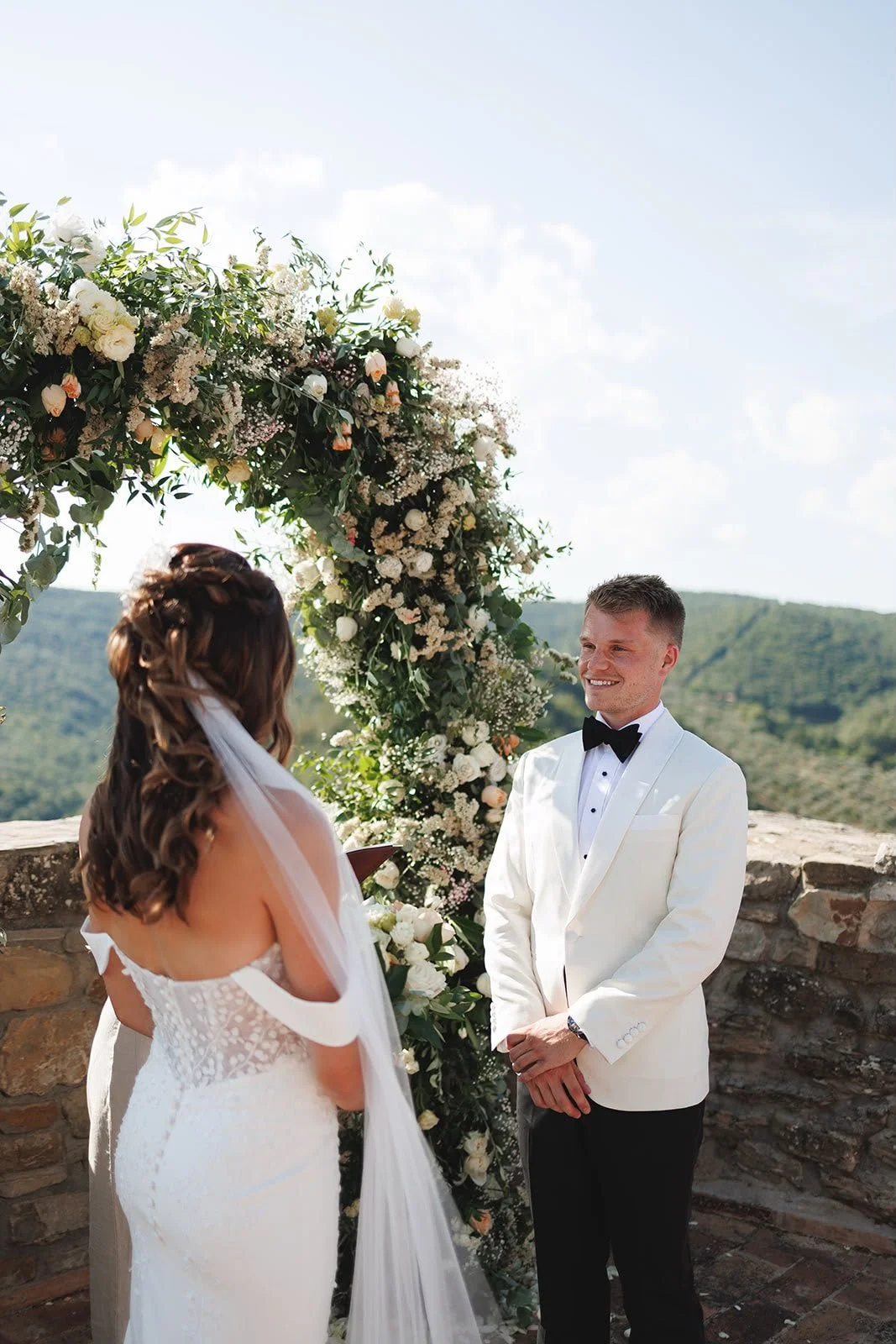 Oliver & Nikkita Vass - Oliver wears white tuxedo jacket and black dinner trousers, with dress shirt also made by Roberto Revilla London