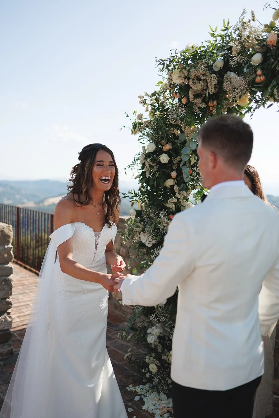 Oliver & Nikkita Vass - Oliver wears white tuxedo jacket and black dinner trousers, with dress shirt also made by Roberto Revilla London