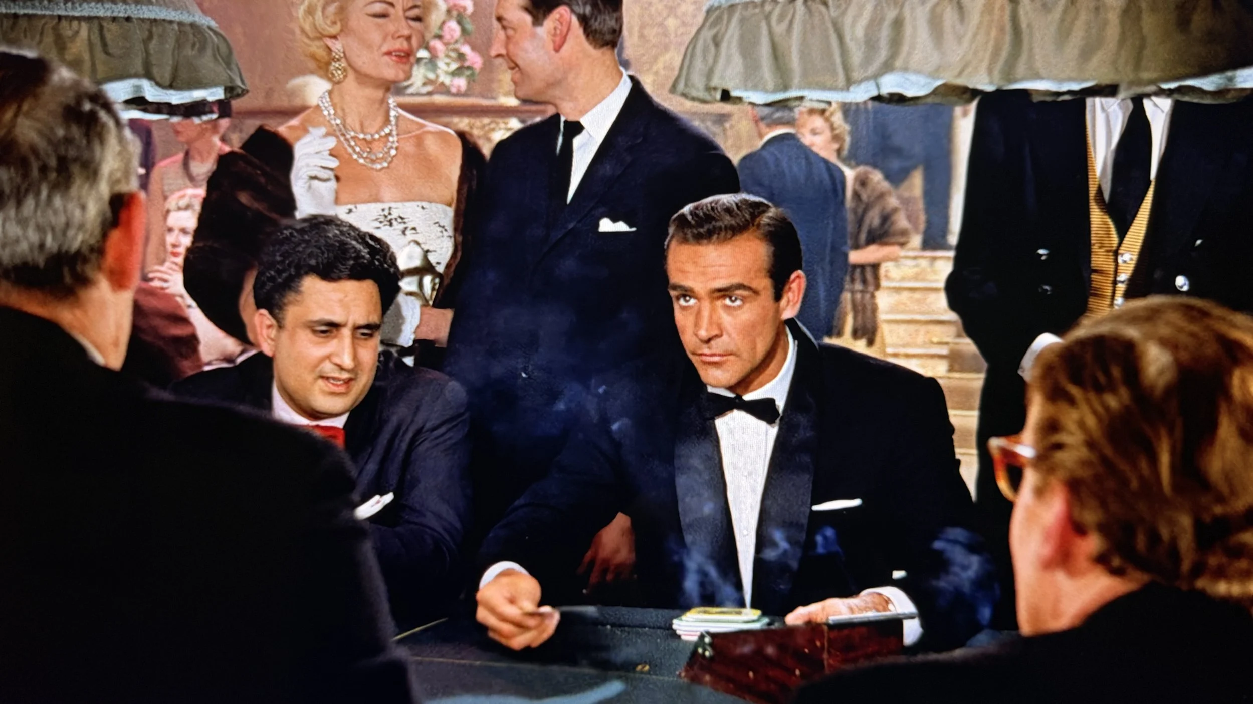 Sean Connery as Ian Fleming's James Bond in Dr. No, wearing a midnight blue tuxedo