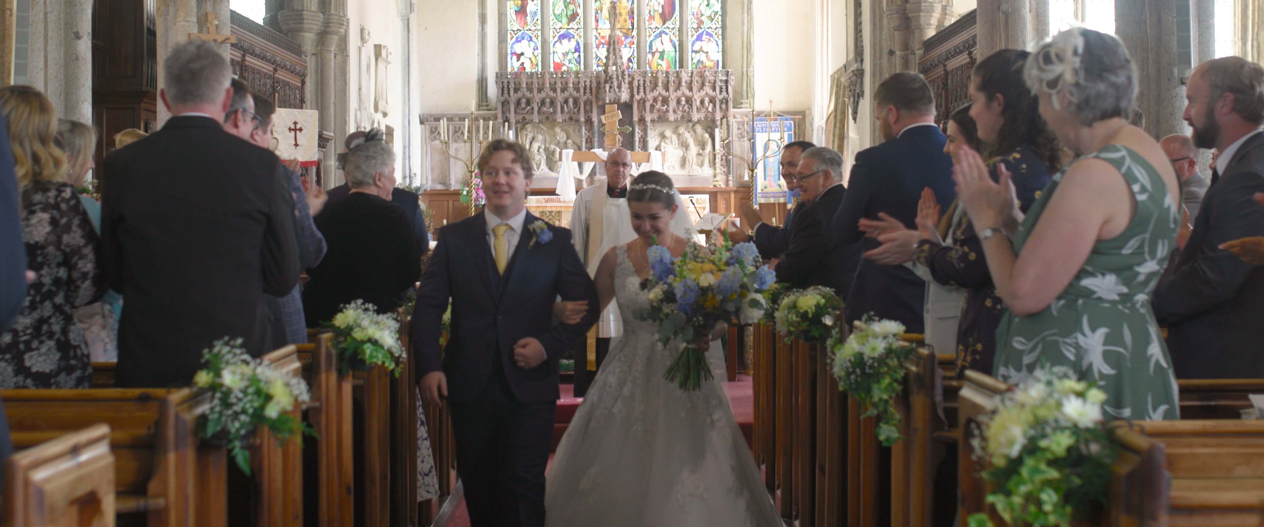 Dael &amp; Emma gleefully walk down the church aisle after being officially announced as married.