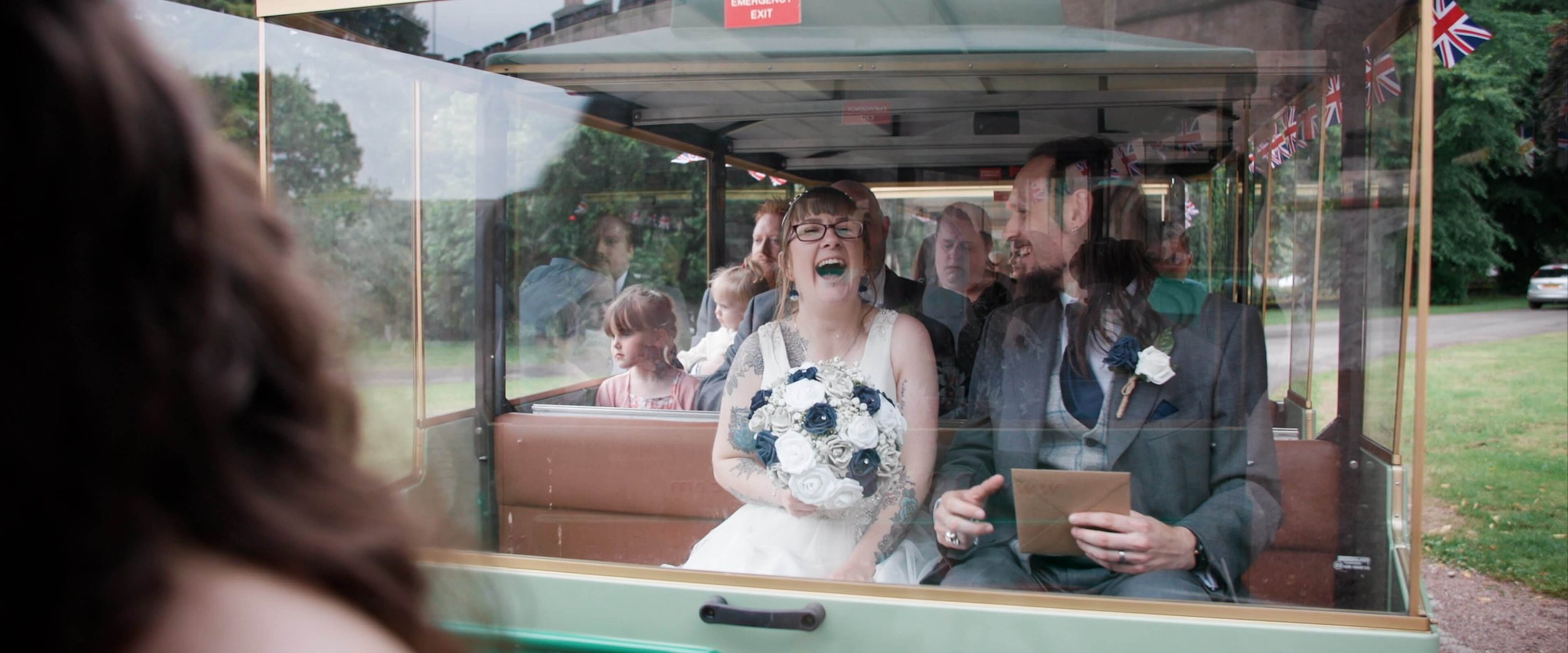 Candice &amp; Colin laugh with each other gleefully aboard The Land Train outside Torre Abbey