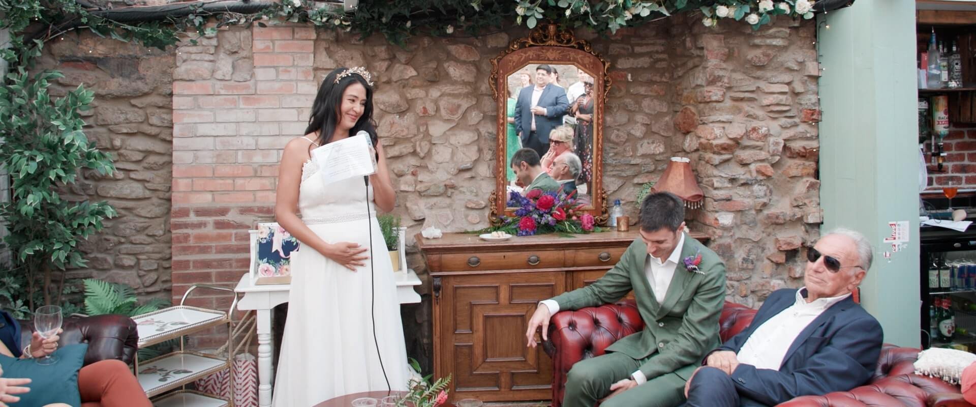 The moment the bride announced she was pregnant at the wedding. The groom sheds a tear.