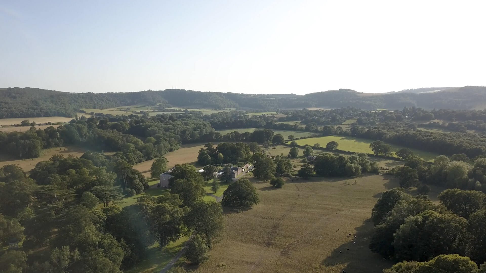 Aerial drone shot of Bignor Park Estate and the surround countryside of west sussex