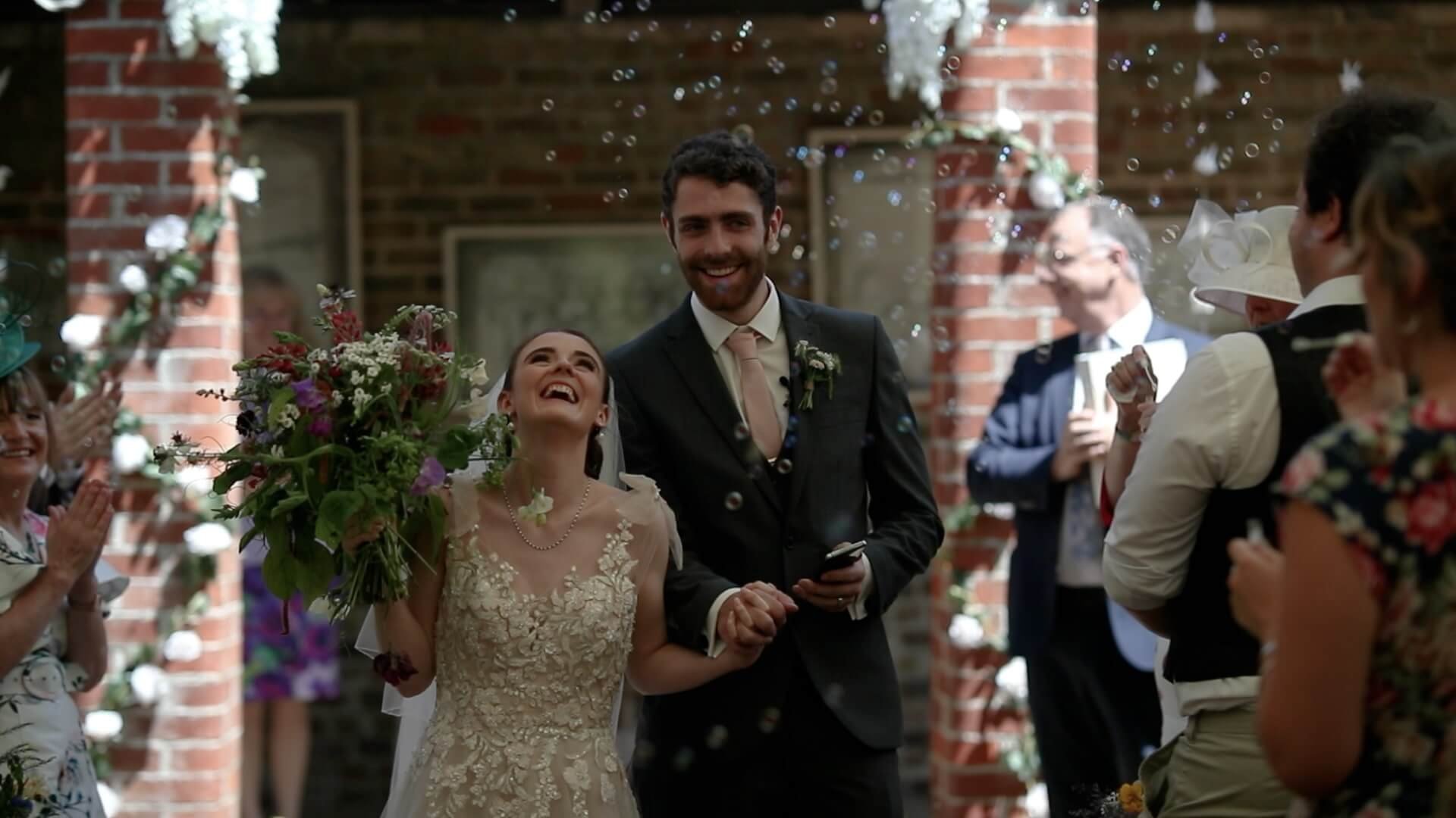 Callum &amp; Toni walk down the aisle after being officially announced husband and wife, with guests blowing bubbles