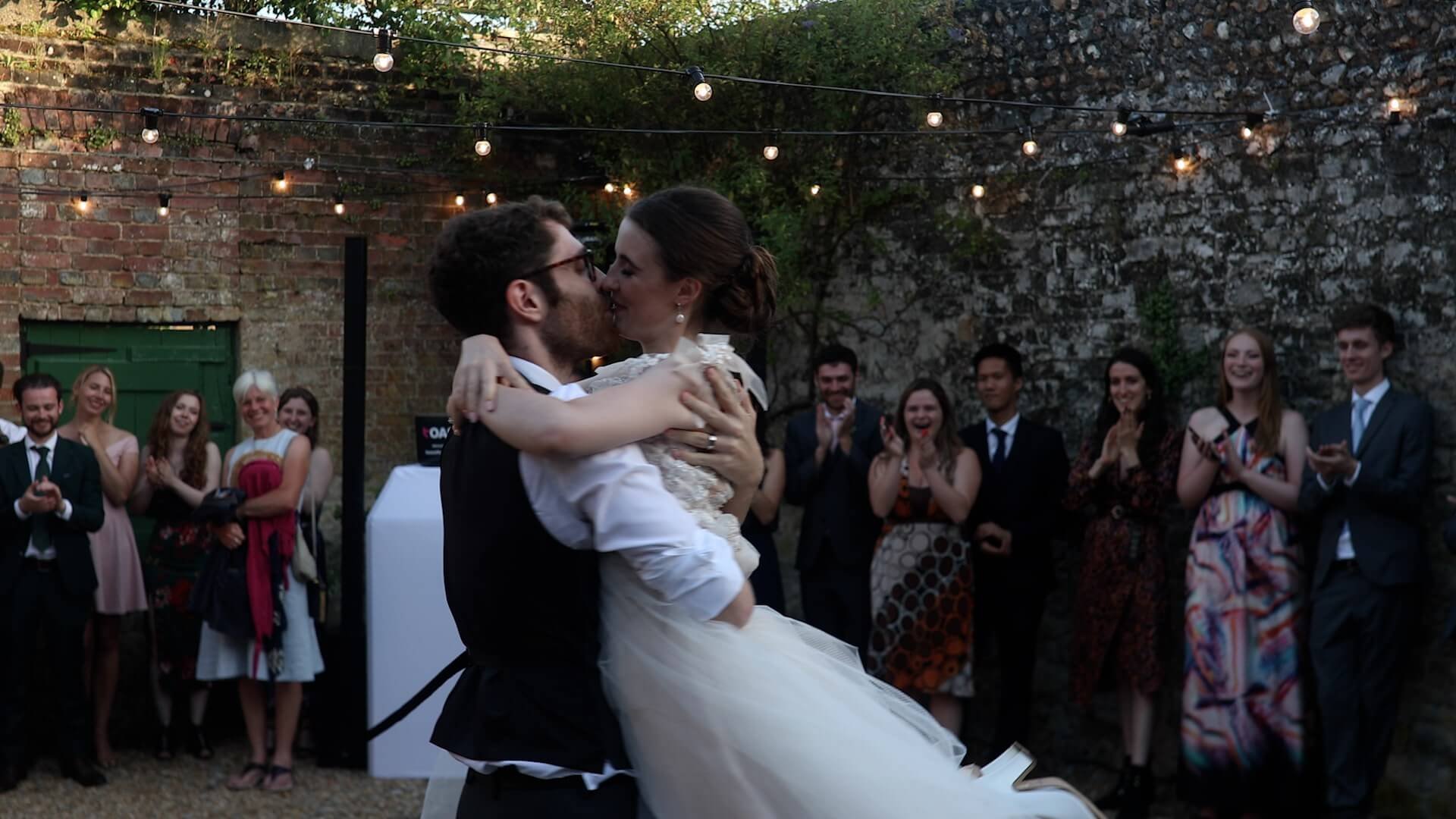 Callum embraces Toni and kisses her during the first dance at Bignor Park