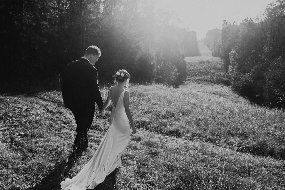 Johnston Woods Wedding Couple in Field.jpg