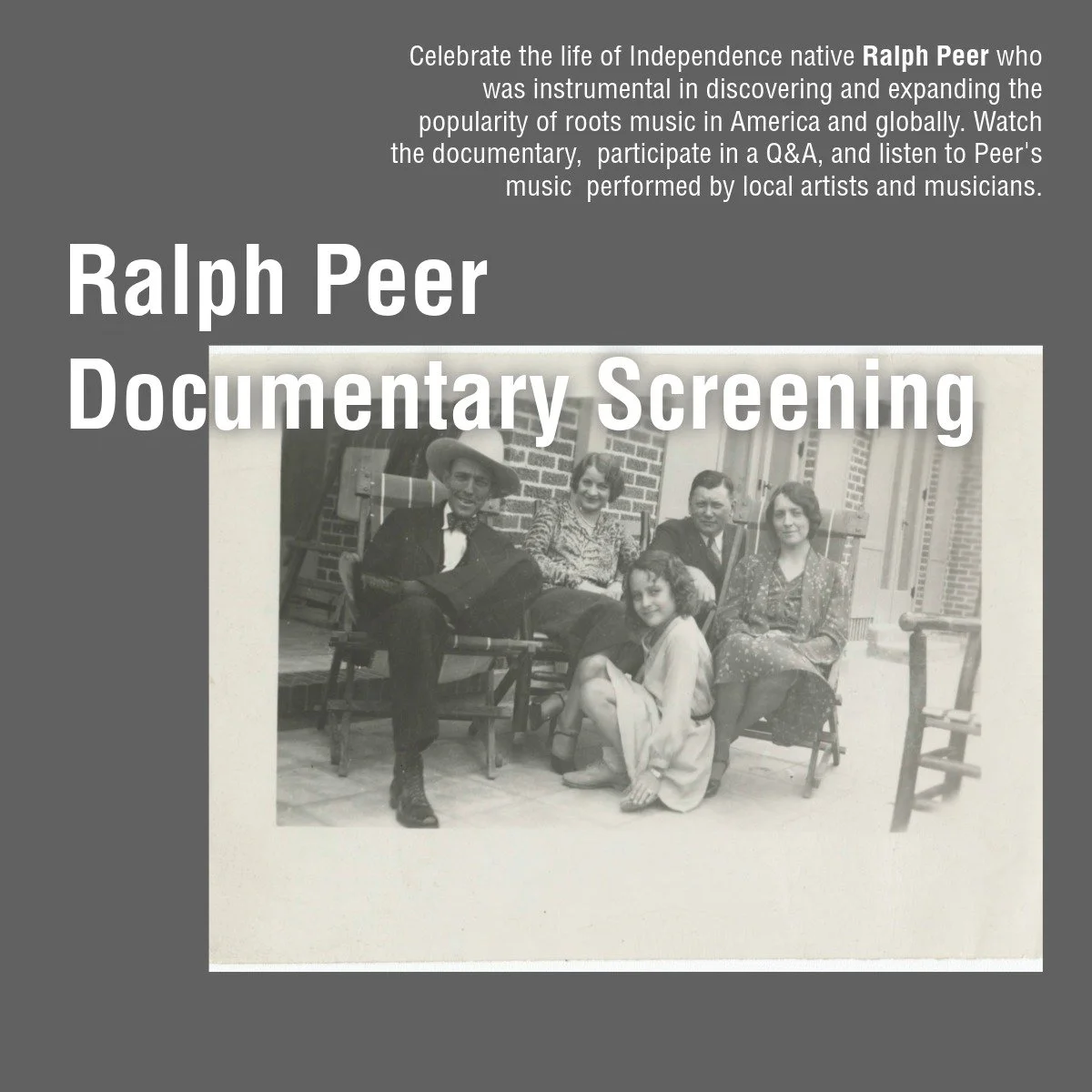 Black and white photo of five people sitting on chairs and a girl kneeling in front. The background shows a brick building and a wooden chair.