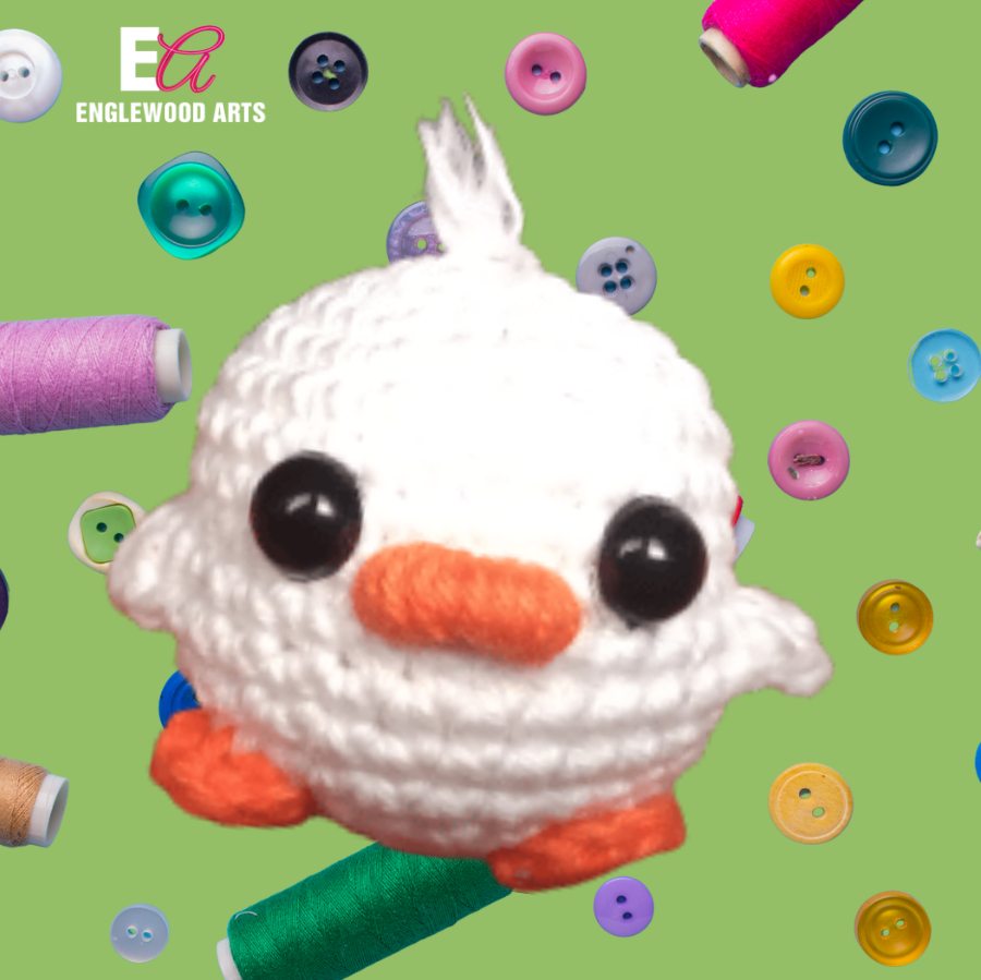a crochet duck on a bright green background