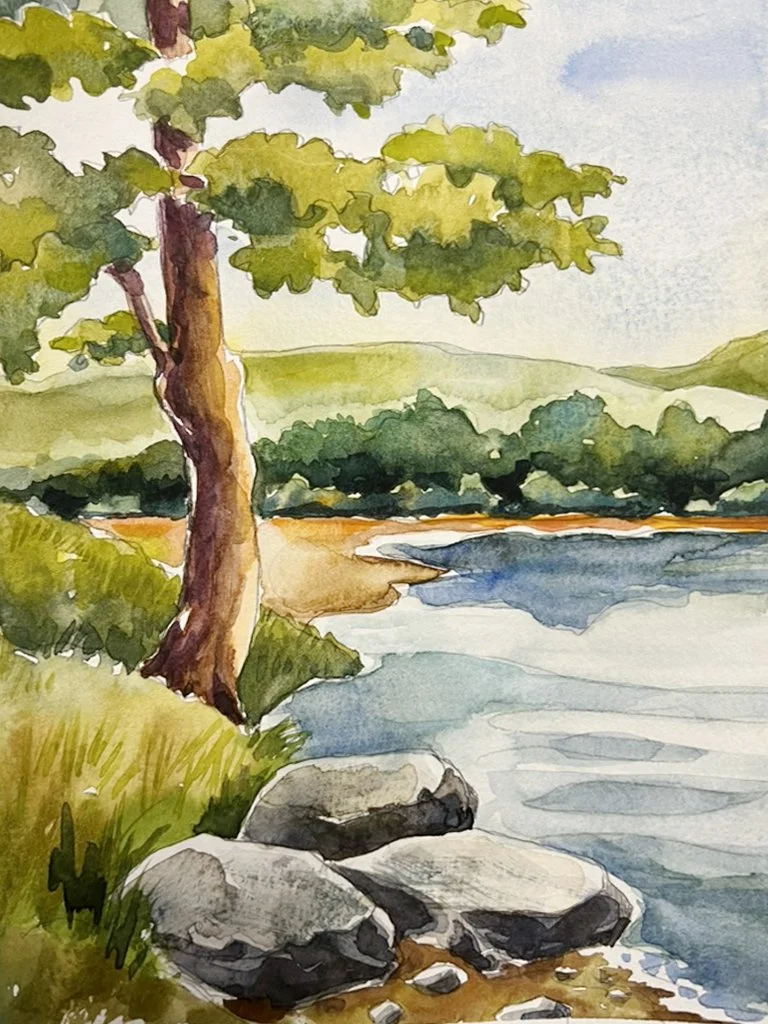 a watercolor painting of a lake with a rocky shore and large tree.