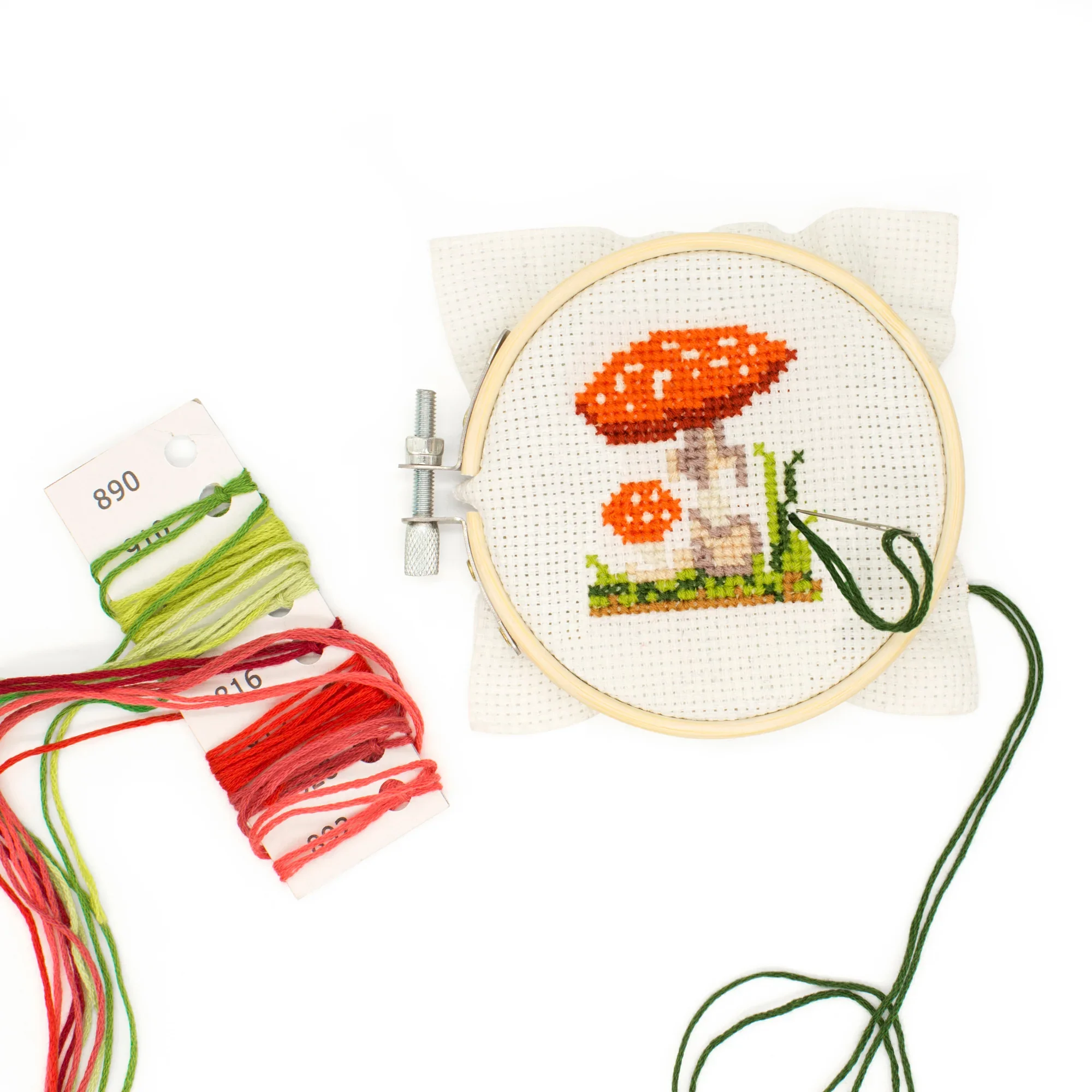 a crochet duck on a bright green background