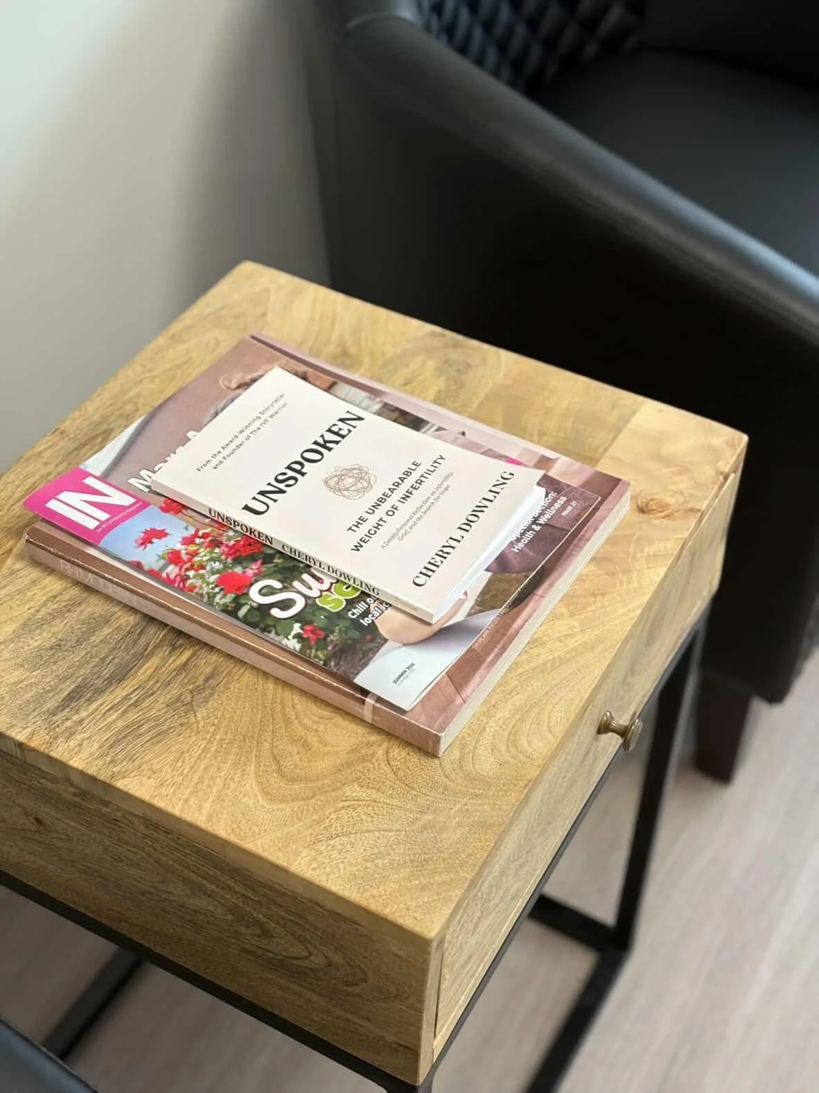 fertility clinic book on table, UNSPOKEN