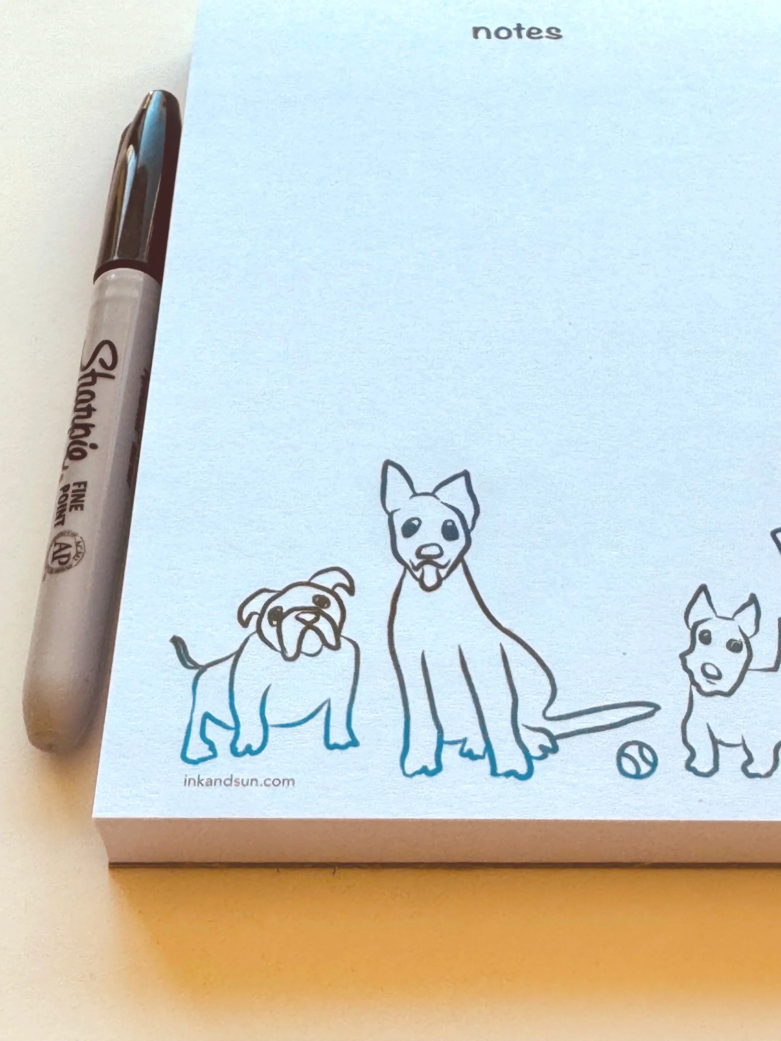 close up of All the Dogs notepad with Sharpie.Ink+Sun