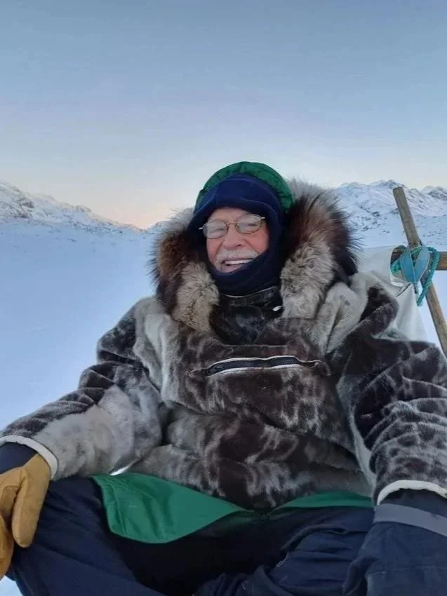 Randy Kiefer bundled in a fur-trimmed parka in a snowy landscape