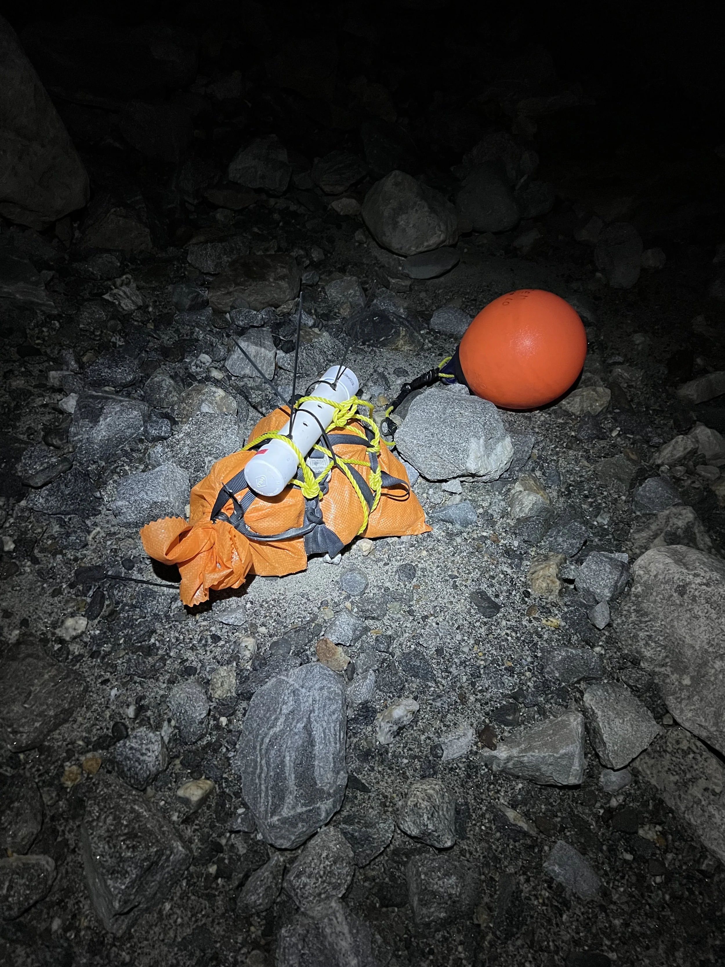  Near-shore pressure transducer mount during low lake stage at night, September 2025 (Photo credit: Jocelyn Reahl) 