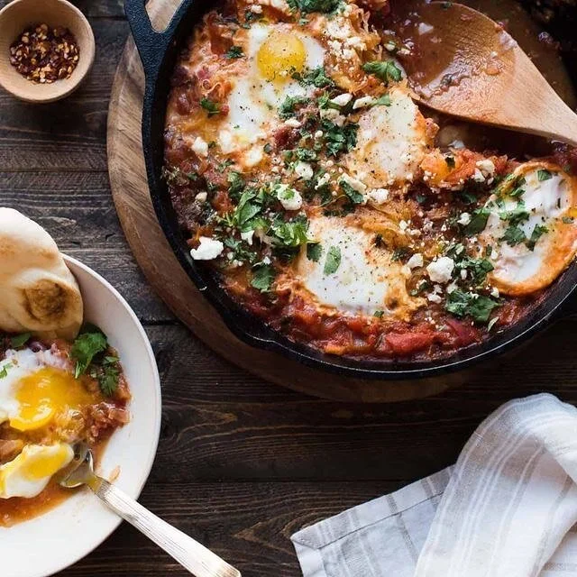 New Winter Menu - now available🍴

How delish does this Shakshuka look?! Eggs nestled amongst a Tunisian spiced tomato sauce with fresh herbs, hummus, feta &amp; Turkish bread 🤤

Who&rsquo;s coming for brekkie? 🙋🏻&zwj;♀️