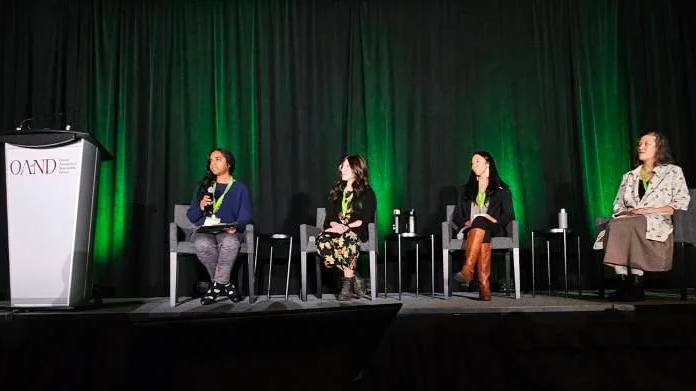 Dr Kristen speaking with her fellow panelists after an intense conversation about the ways we've been impacted by unconscious bias in life, as patients and as health care practitioners.