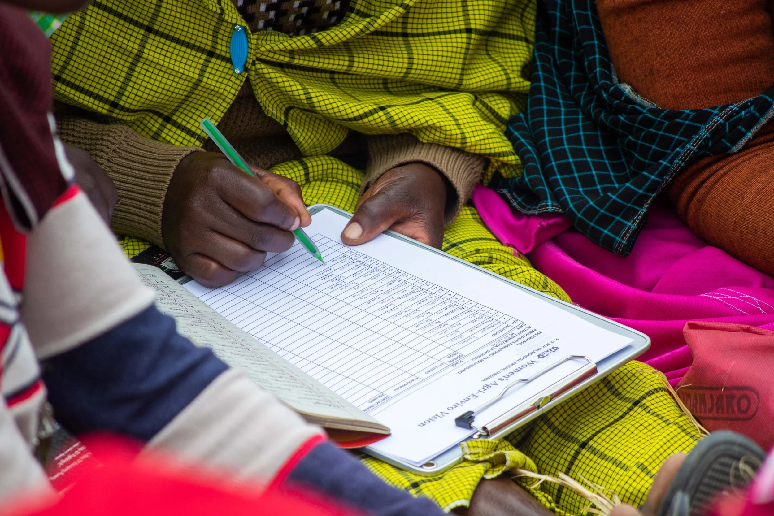Bookkeeping is an important part of  women's group meetings. Learning how to maintain information on loans and businesses is an critical part of our trainings. 
