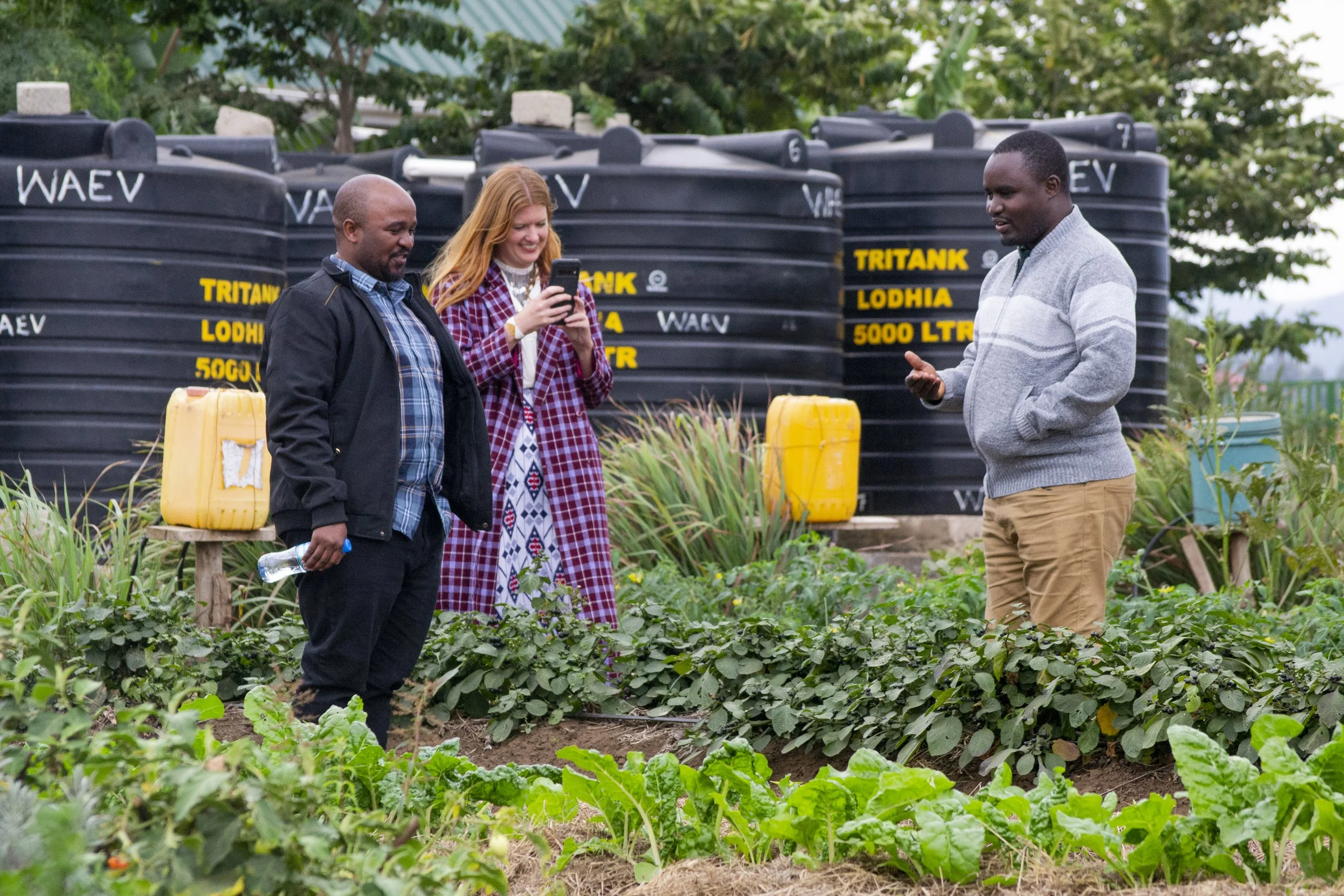 Saing'orie showing the efficiency of our drip irrigation systems on our demonstration plot.