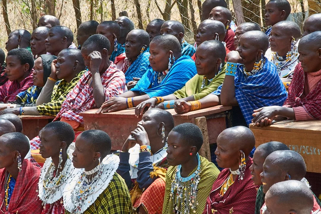 Women discussing business strategies during a group meeting.