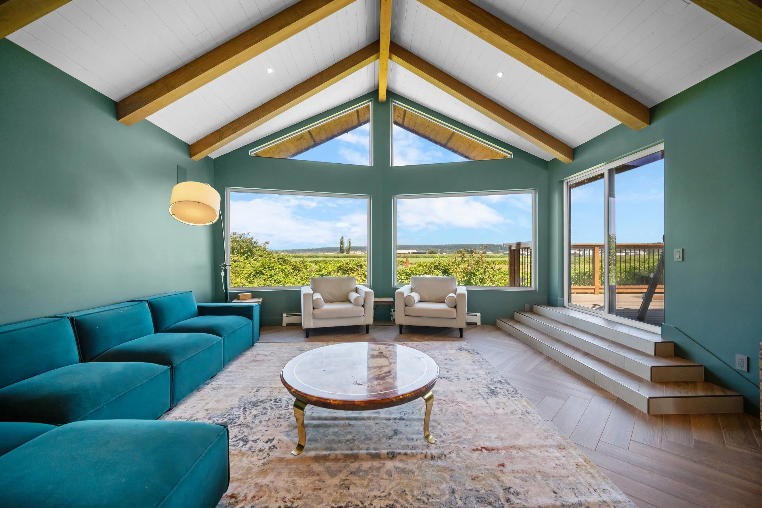Pacific Northwest custom home renovation exposed metal accents and wood beam ceiling