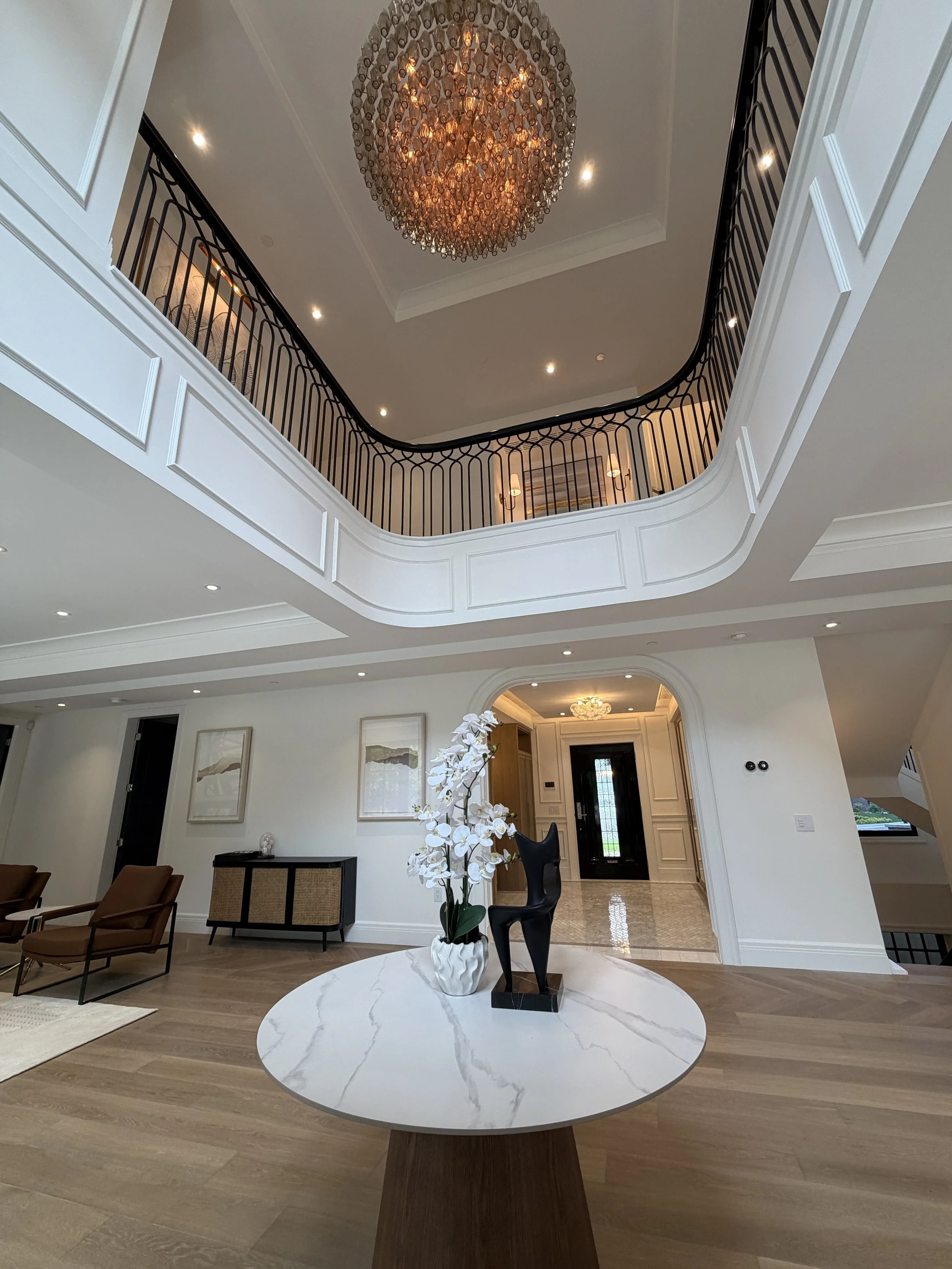A brightly lit entry way with custom trim by Butler in Vancouver