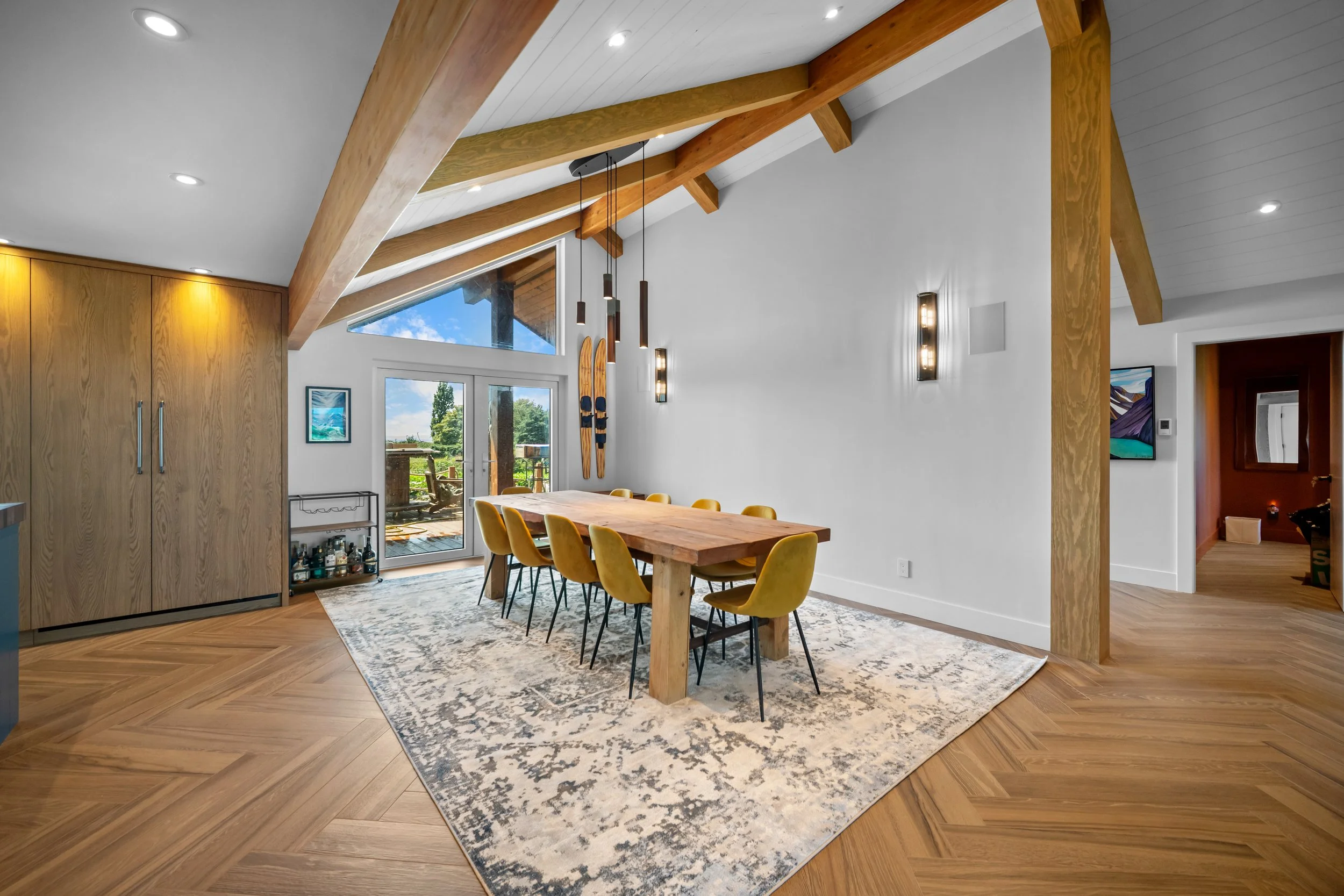 Pacific Northwest custom home renovation exposed metal accents and wood beam ceiling