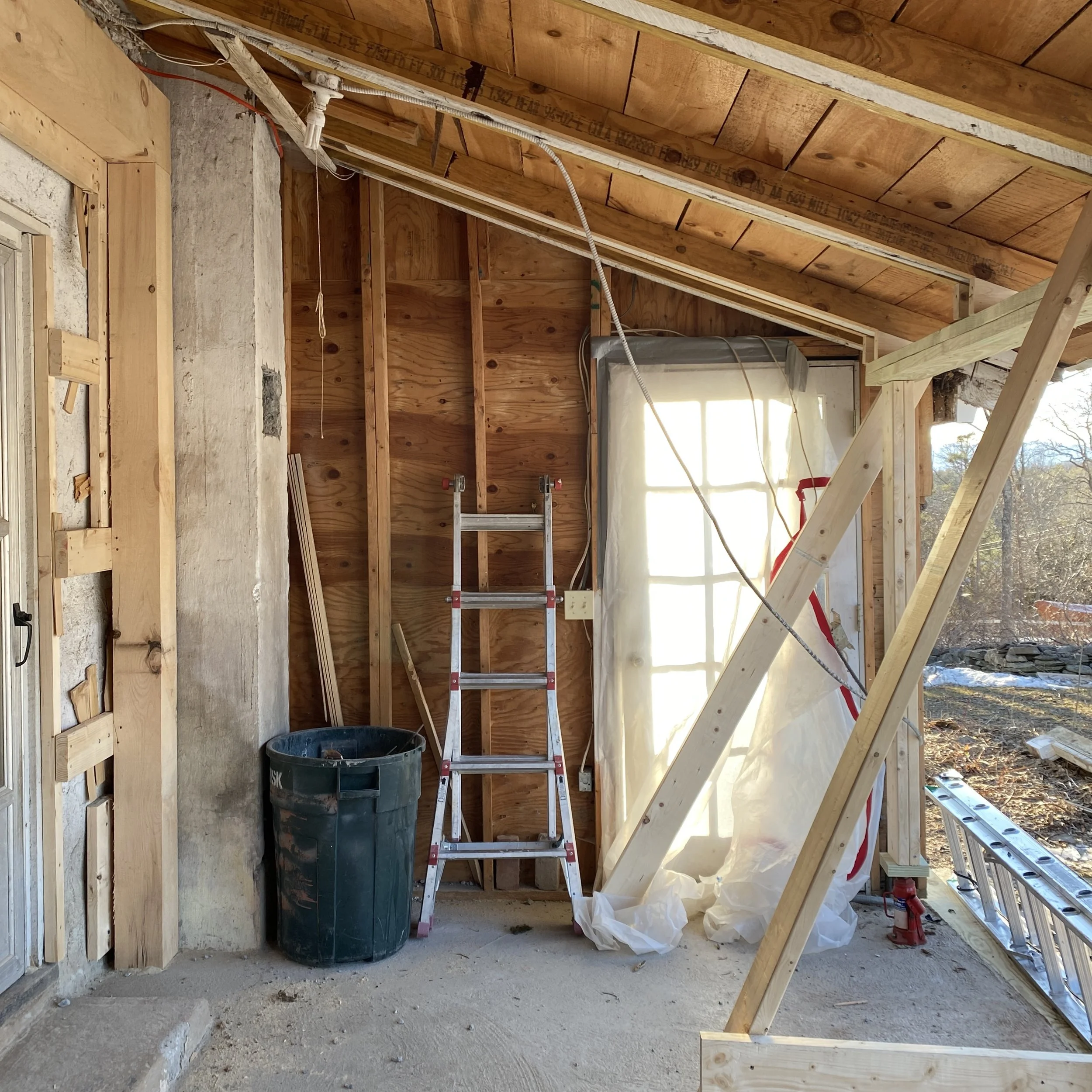 The West wall that once lead to a screened-in porch