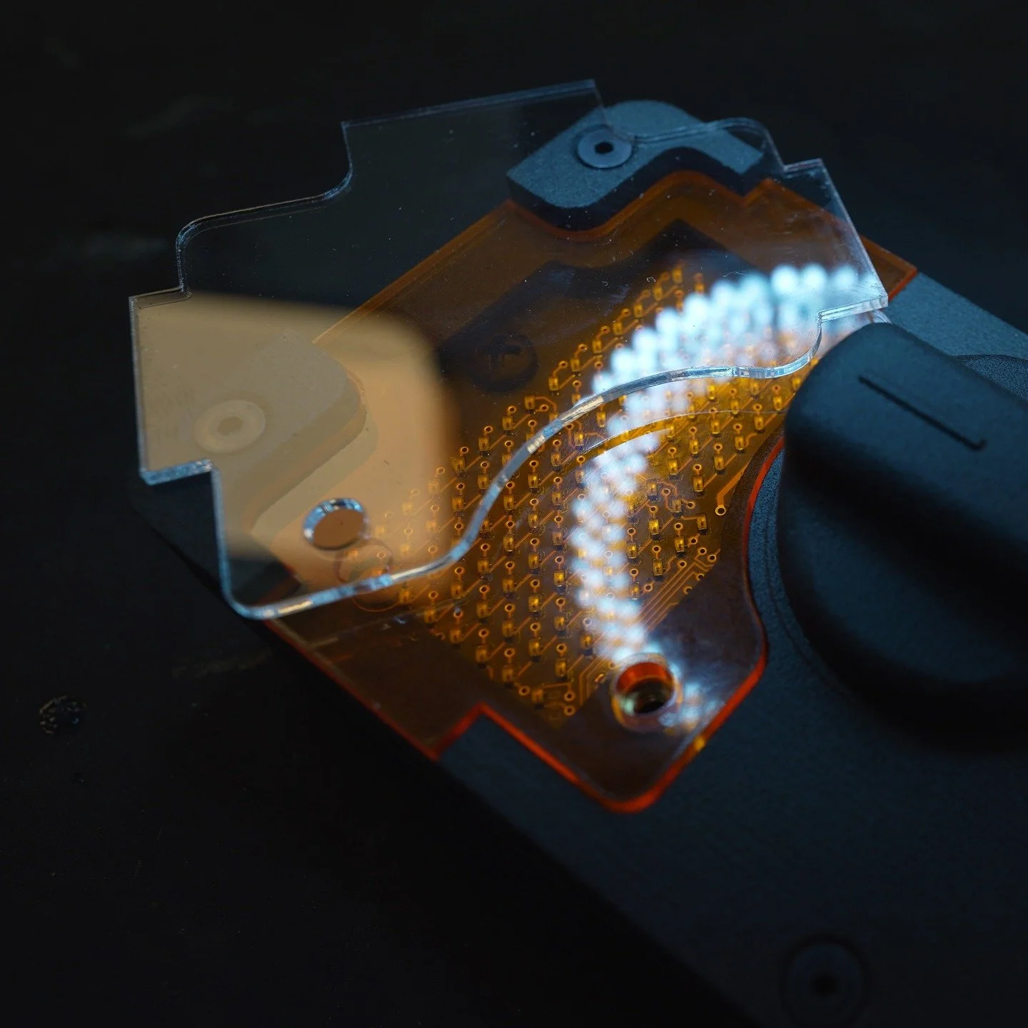 The G1 Wireless Welding Hand Remote has clear protective covers for the amber colored screen. Why amber, because at the moment for brightness in lumens, the leds on the board are orange and their wavelength passes through the amber intact.

In this p