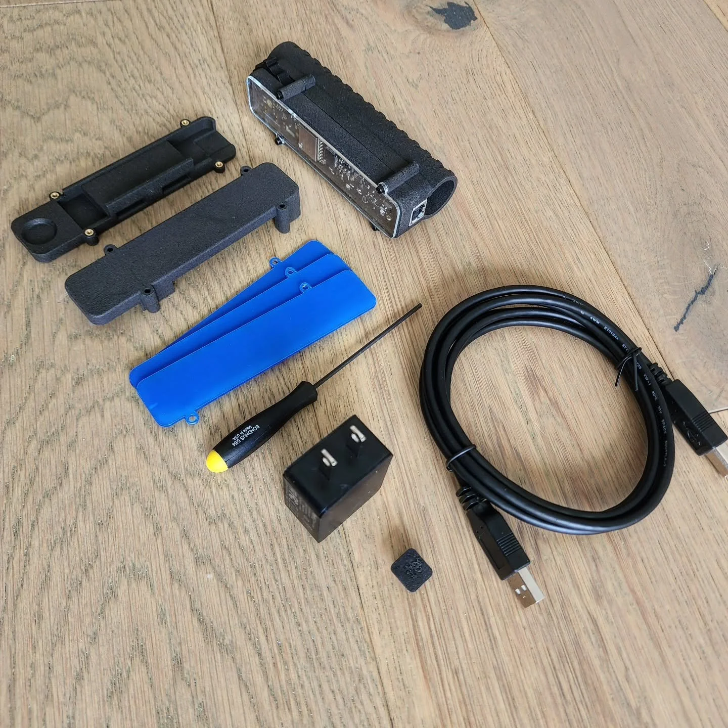 Ok. Got a grip on the contents of a Gamechanger Module Thumbwheel Edition.

Comes with:

1. GM Module Board
2. 17 series torch body
3. Alternate Lower body for electrical tape mounting.
4. Upper Body (clear cover)
5. Upper Body (solid cover)
6. Charg