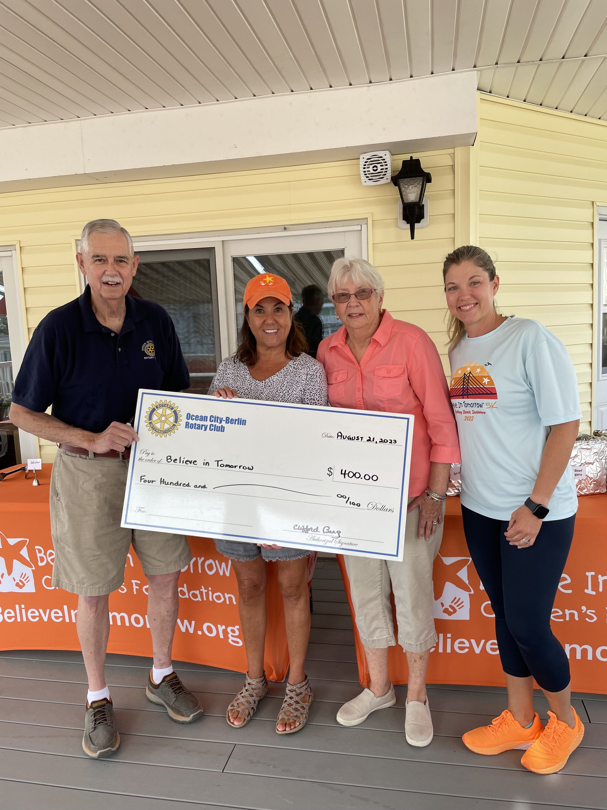  The Club recently helped serve dinner and presented a check to  Believe in Tomorrow's Children House by the Sea representatives.   