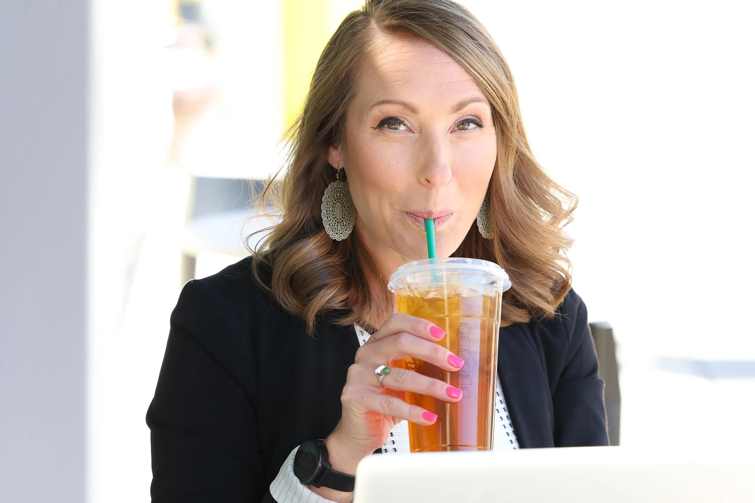 Woman drinking ice tea