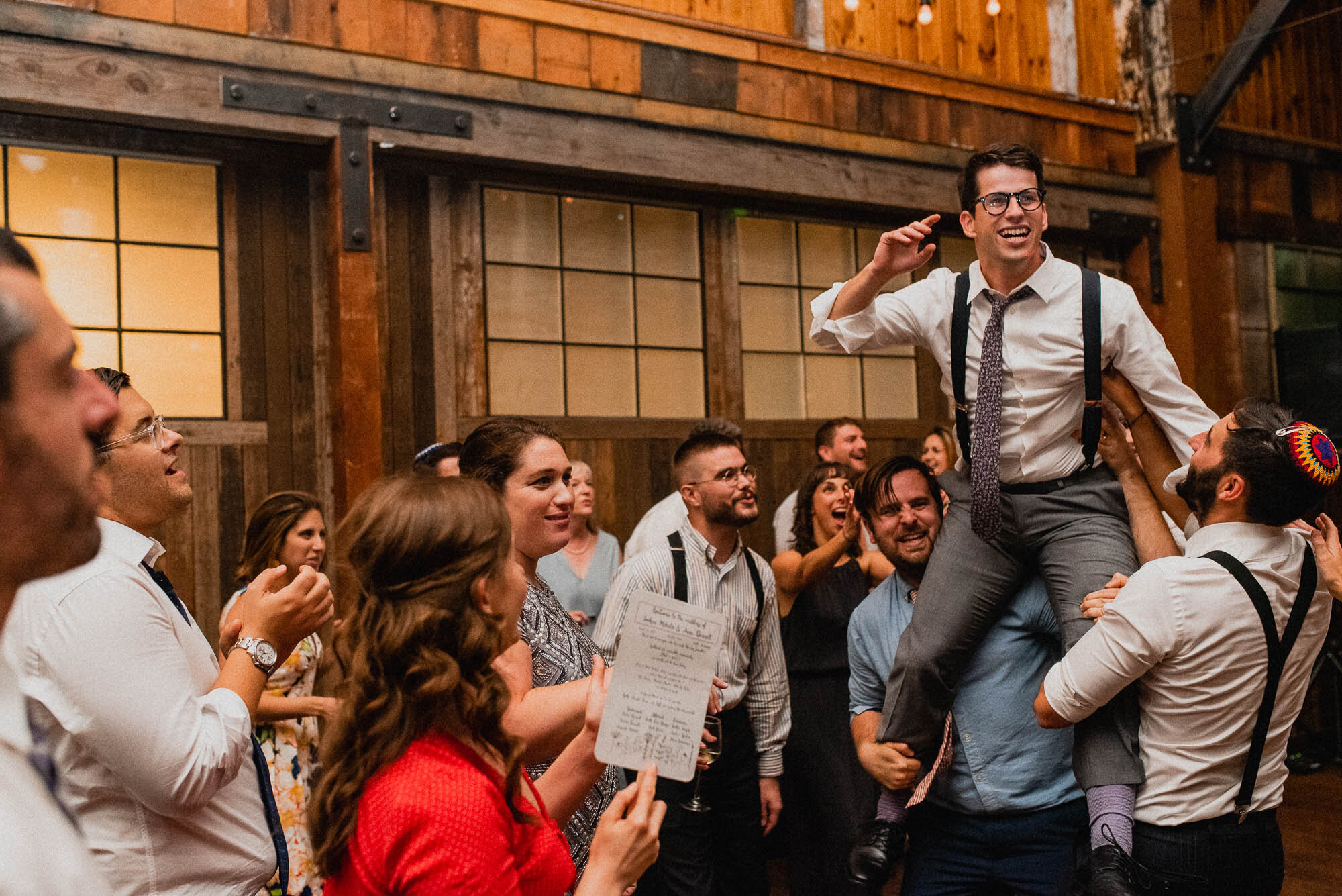 sodo-park-jewish-wedding-reception-groom-candid.jpg