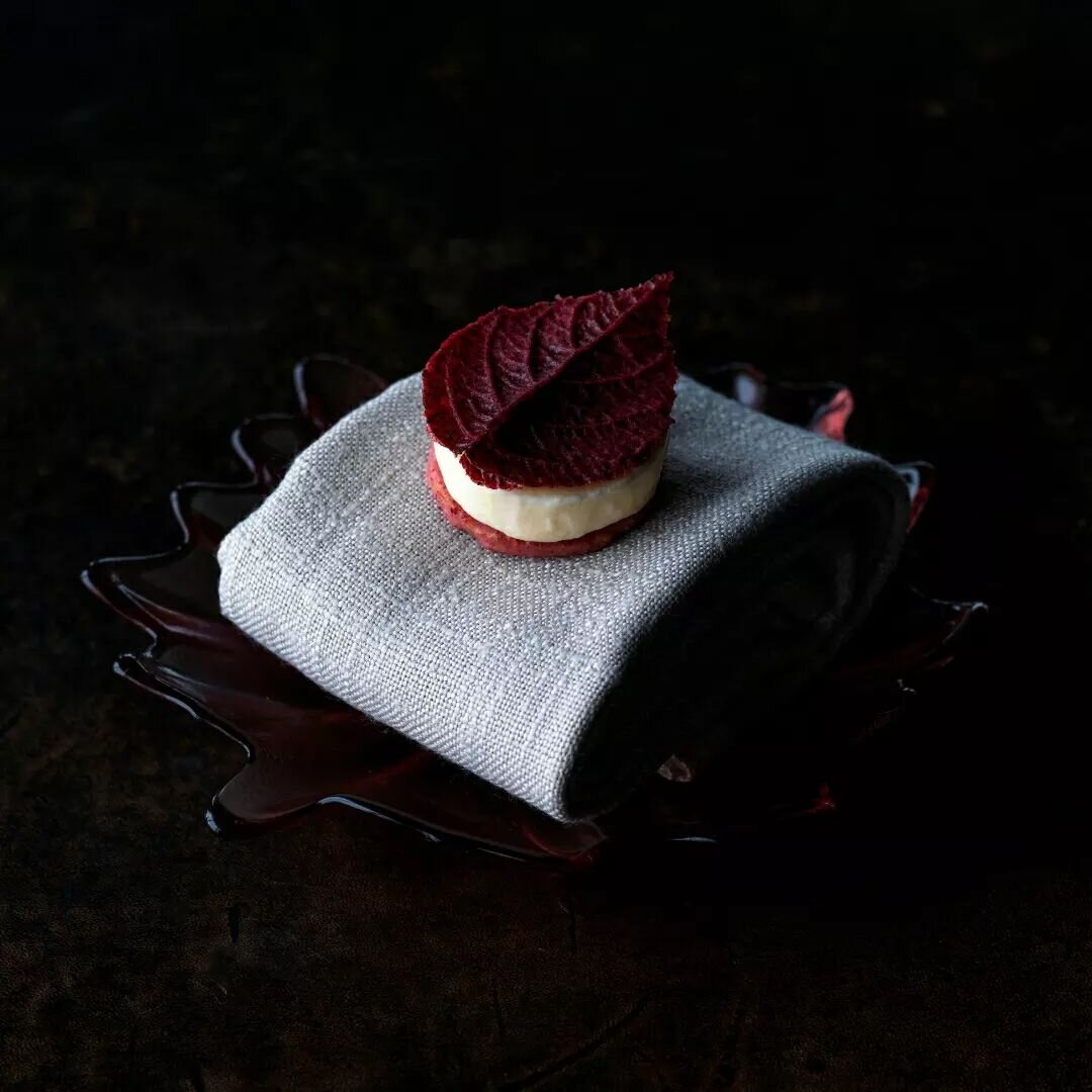A leaf of Davidson plum, ruby chocolate + fresh roses. The perfect little pre-dessert.