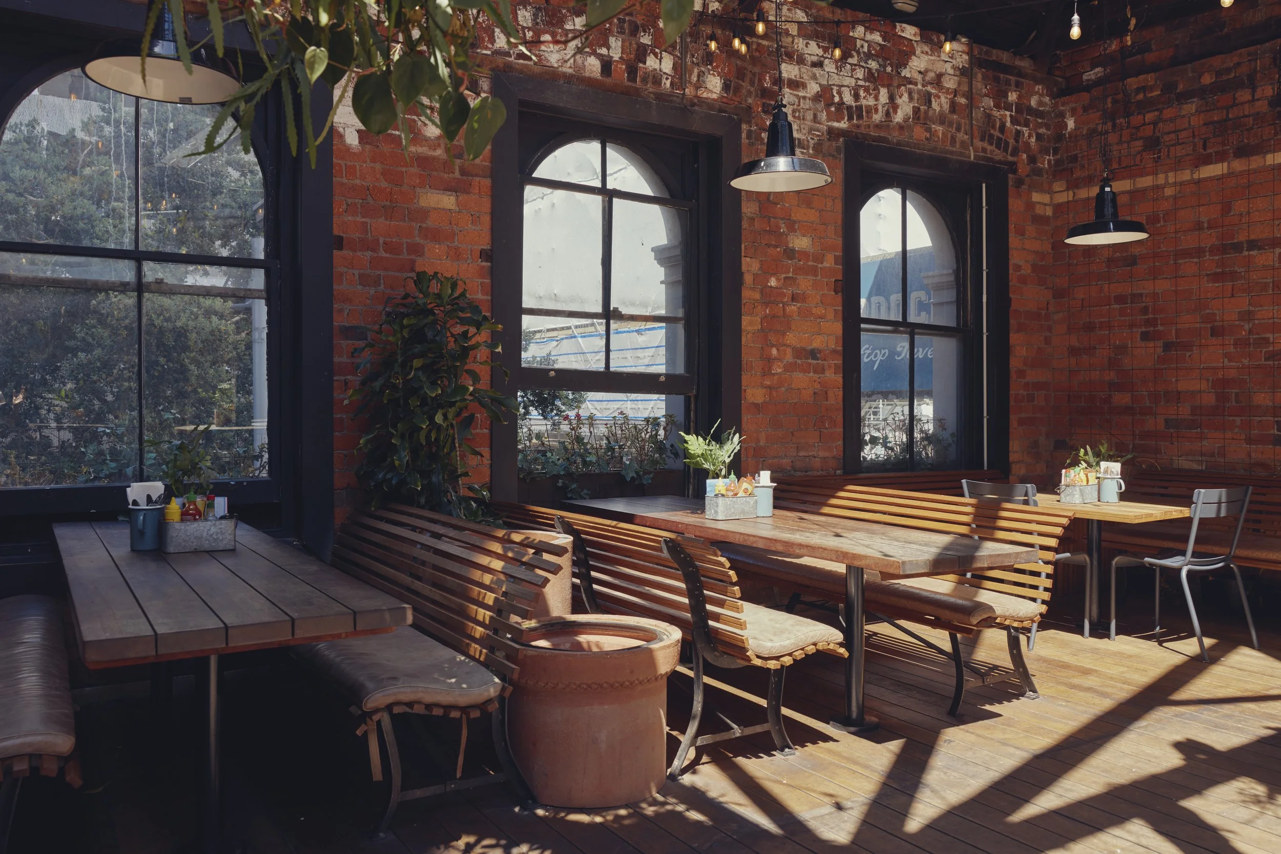 Outdoor booth seating at Mr Murdoch’s rooftop bar in Auckland