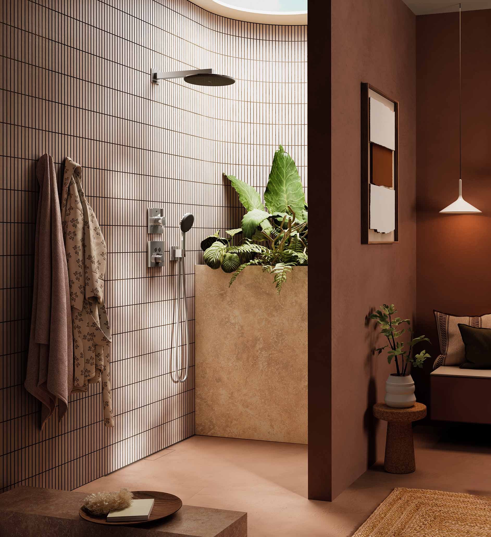 Modern shower area with black tiled wall, hand towels hanging, and indoor plants. Adjacent is a cozy corner with a plant, wall art, and a white hanging light.
