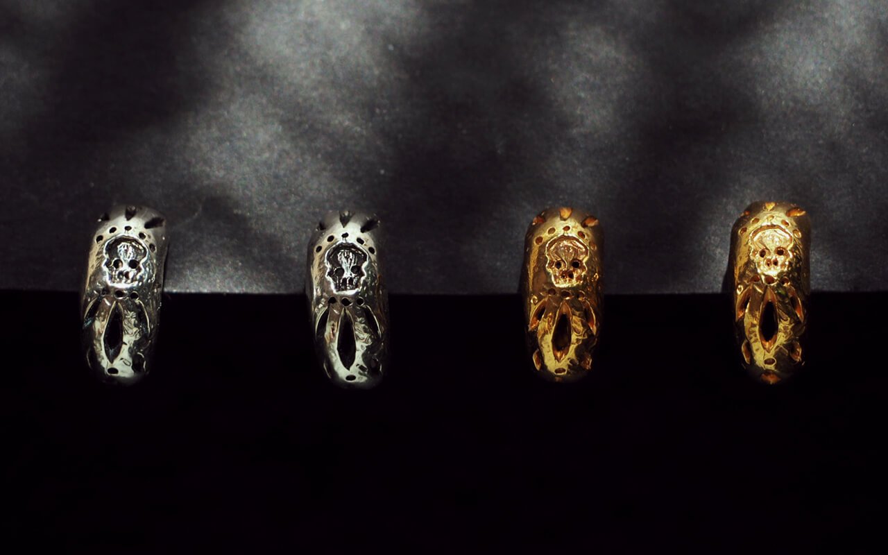 Silver-and-Gold-Montoni-carved-skull-hoop-earrings-front-on-SLAB-Jewellery.jpg