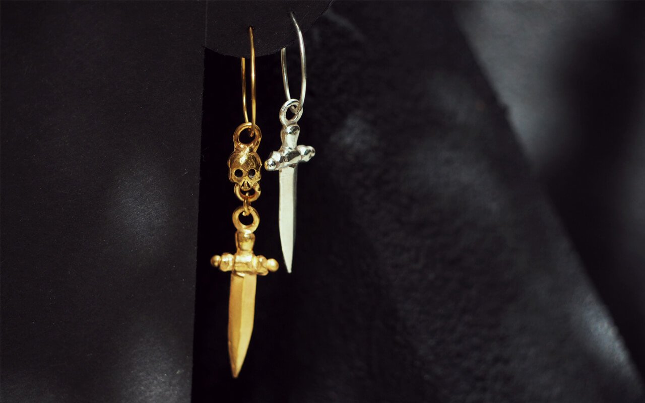 Silver-Orsino-dagger-charm-earring-Gold-Valansino-skull-dagger-charm-earring-SLAB-Jewellery.jpg