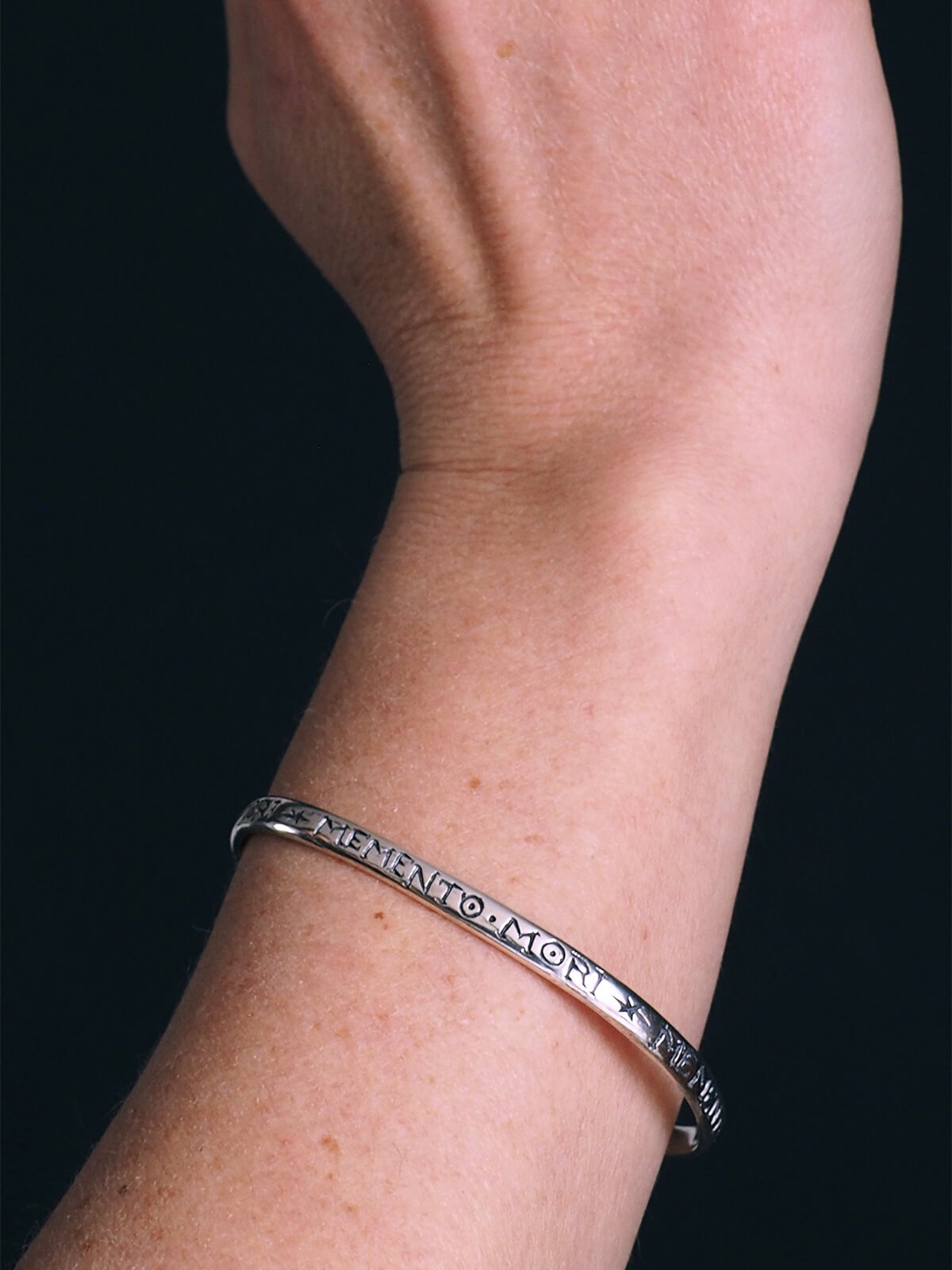 Lyddia-Inscribled-Bangle-Silver-Worn-close-up-SLAB-Jewellery.jpg