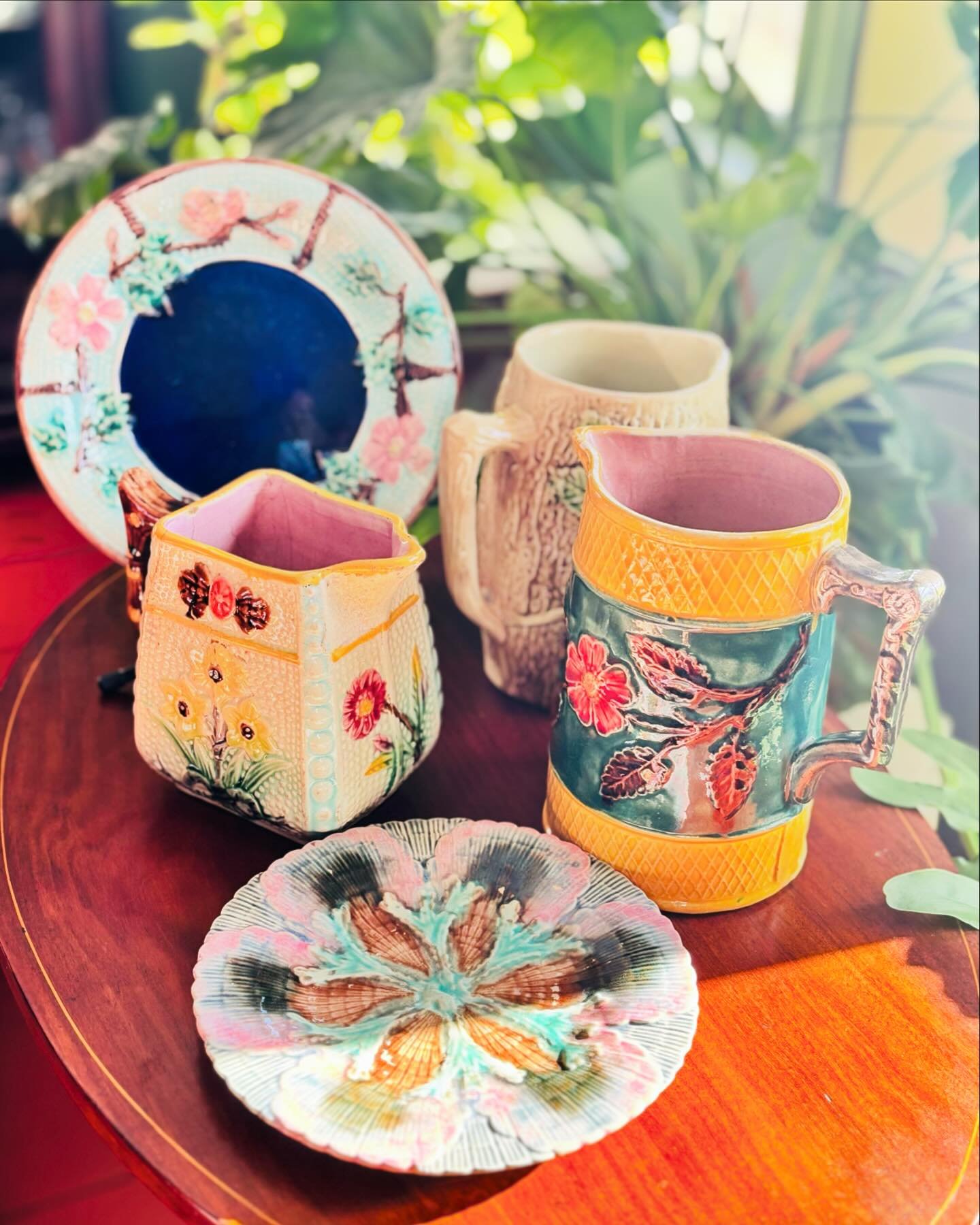 As a gardener, I am drawn in by the bright and whimsical nature of these majolica pieces displaying intricate raised patterns of flowers, branches and leaves. Majolica Pottery has been around for centuries, but these pieces continue to capture my att