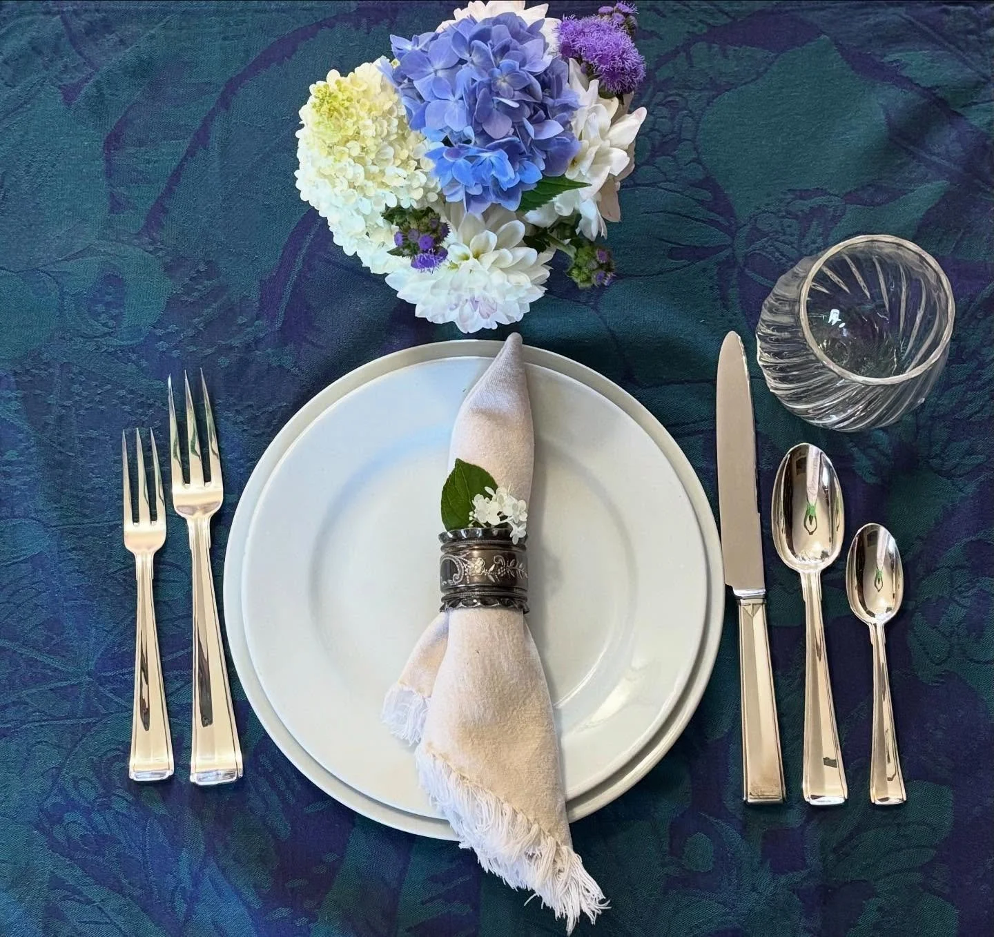 This French Sterling Silver flatware set is simple, graceful, and timeless. A service for four, it comes with one knife, two spoons, and two forks per setting.

Each piece has a lovely weight in hand and a design that pairs effortlessly with any tabl