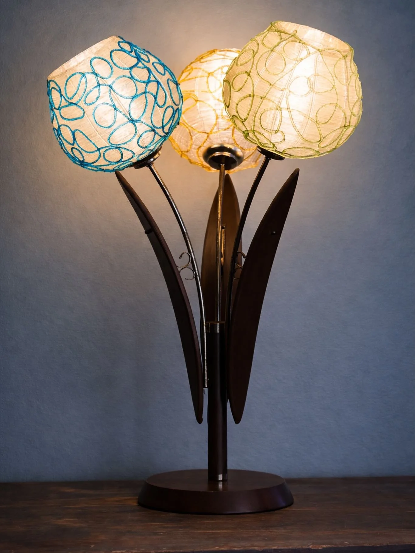 Both light and sculpture, this spaghetti globe lamp captures the spirit of mid-century design.

Popular in the 1950s&ndash;1970s, spaghetti lamps are defined by their wrapped globes&mdash;fine strands layered to create texture, movement, and a softly
