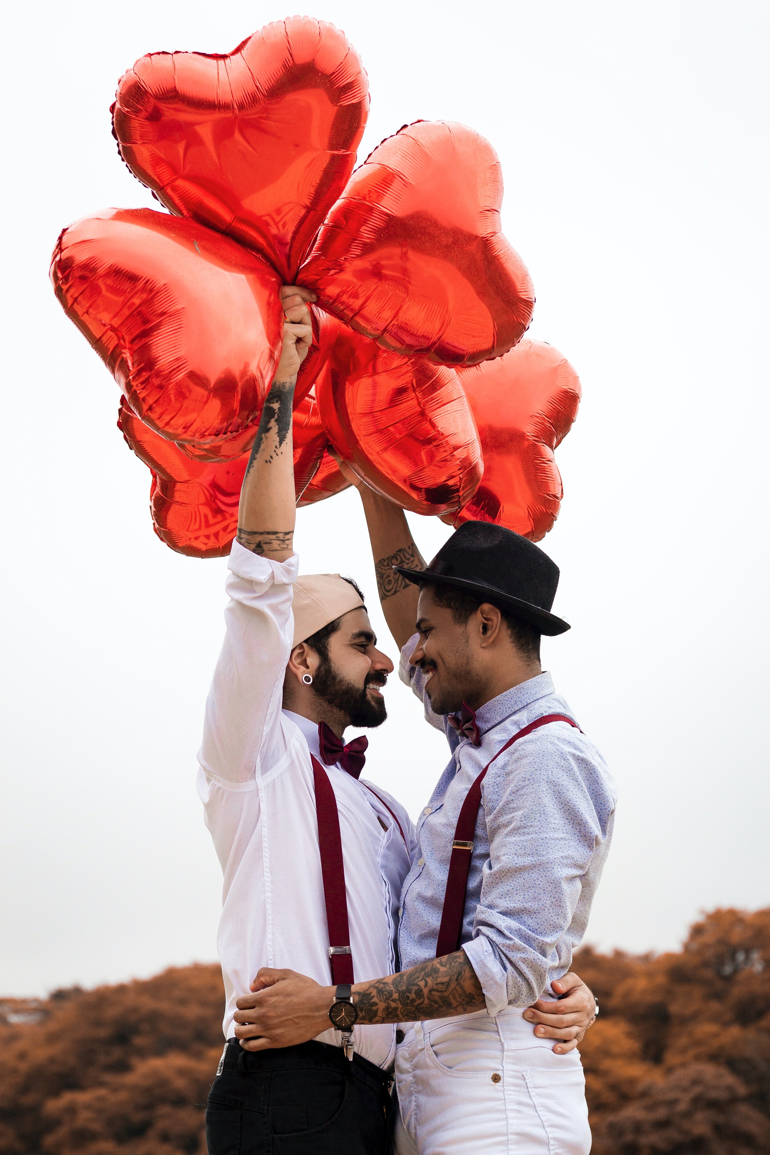 two-men-holding-red-heart-balloons-1756632.jpg