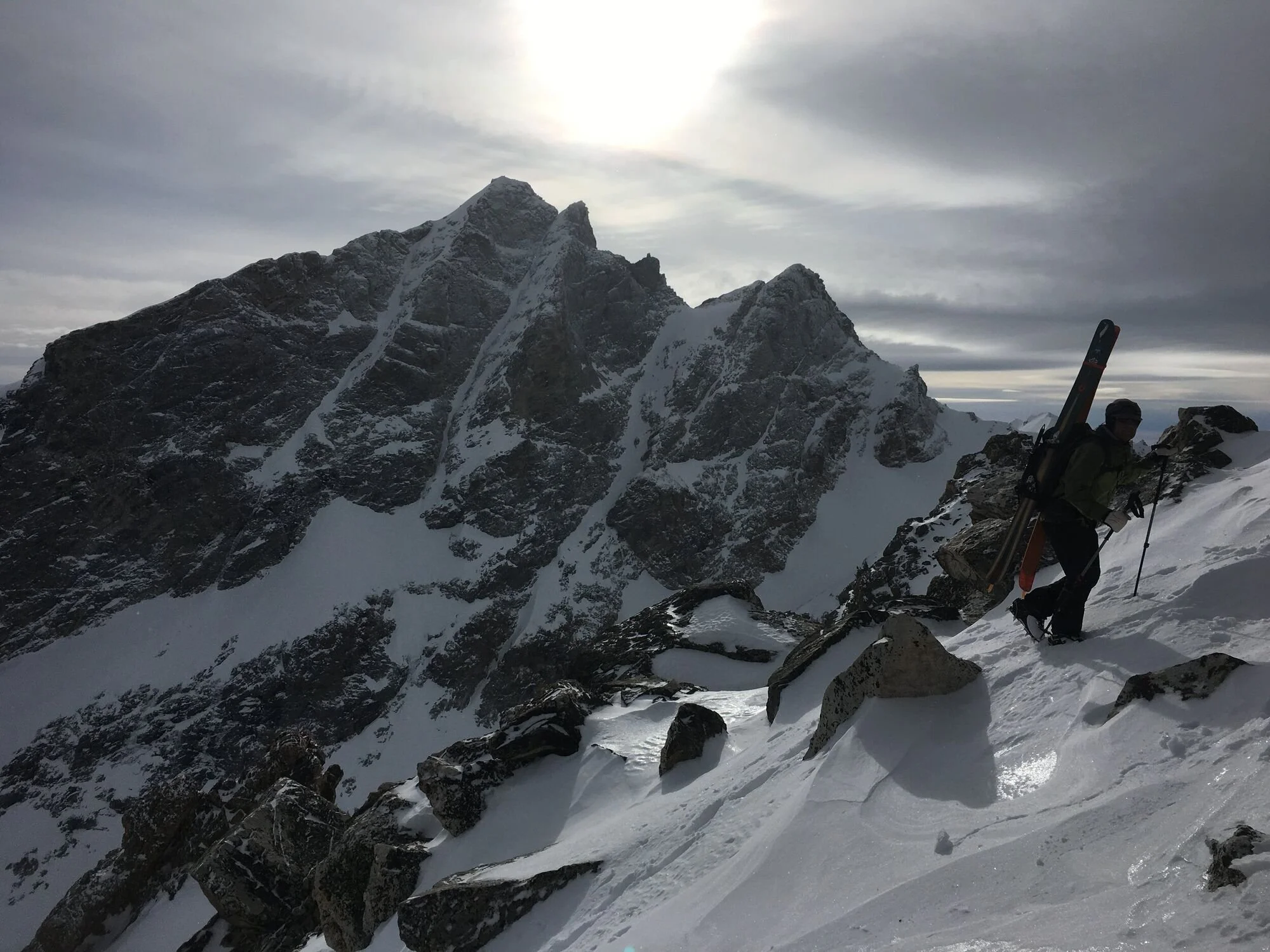 backcountry-skier-hiking-snowy-ridge-tetons.jpeg