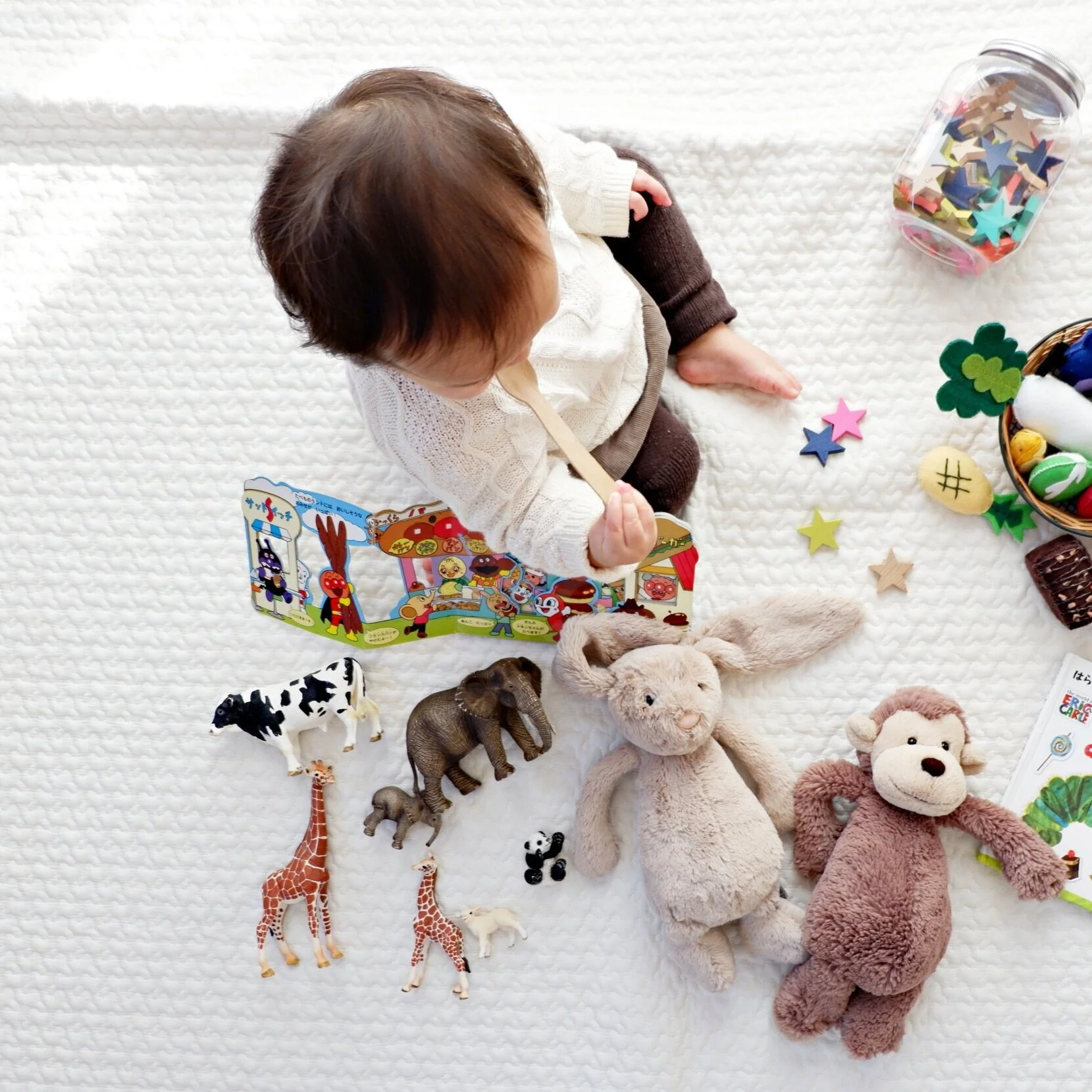 Small child playing with toys
