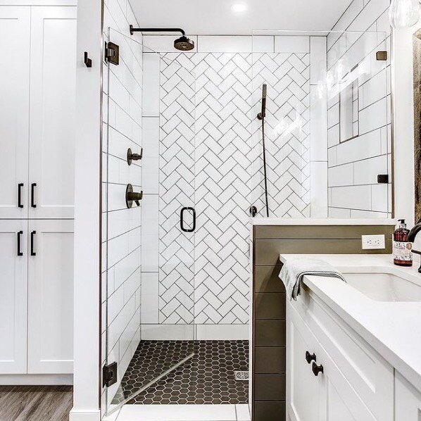 The beautiful herringbone tile on the back wall was chosen to compliment the simple yet stunning shiplap laid tile on the side walls. Casual elegance in the LAKE BONA VISTA RENO.

This has to be one of our favourite bathrooms we have designed in this