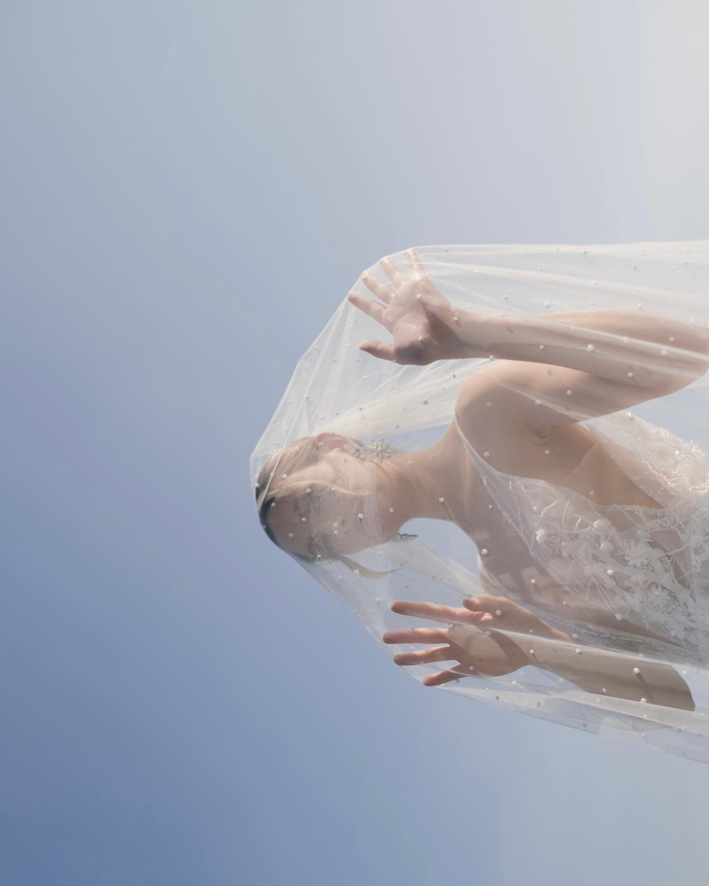 Valerie, an ethereal vision, her veil dancing in the wind, adorned with the exquisite elegance of Oscar de la Renta earrings 
@oscardelarenta @holtrenfrew 
#EleganceInMotion #OscarDeLaRenta 

Gown and veil @dicarlocouture_official