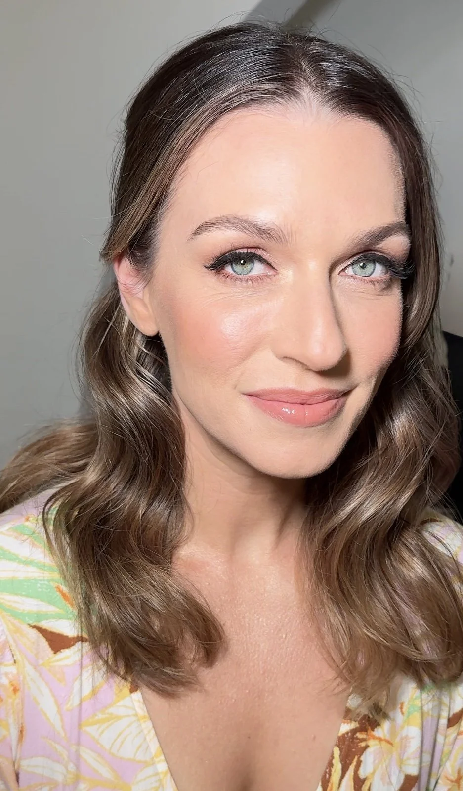 Delicate Peach Glow Makeup with Wavy Hair