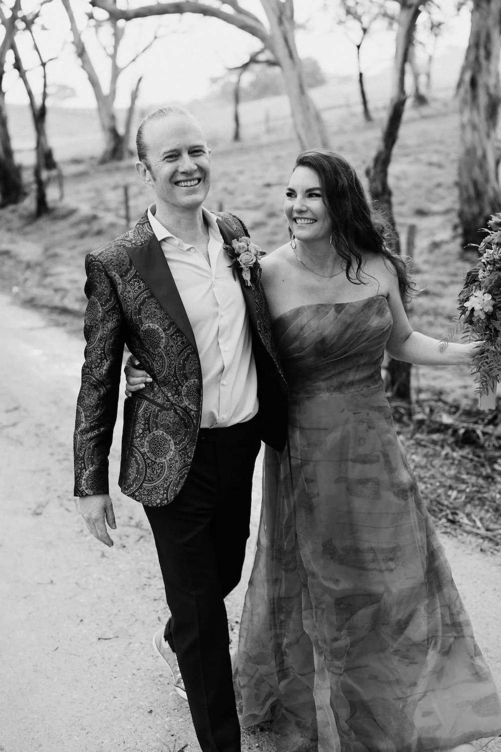 Newlyweds walking joyfully after their ceremony