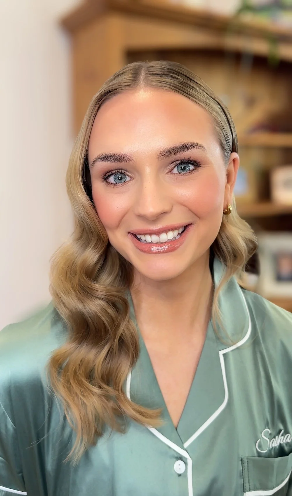 Bridesmaid with bronze makeup and soft waves in Adelaide